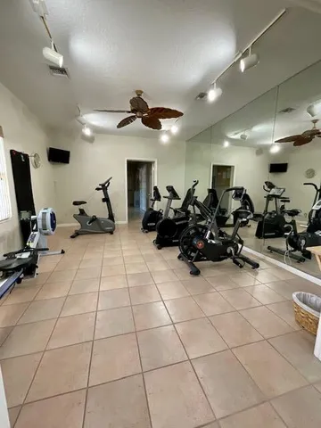 an empty room with a empty space and a ceiling fan