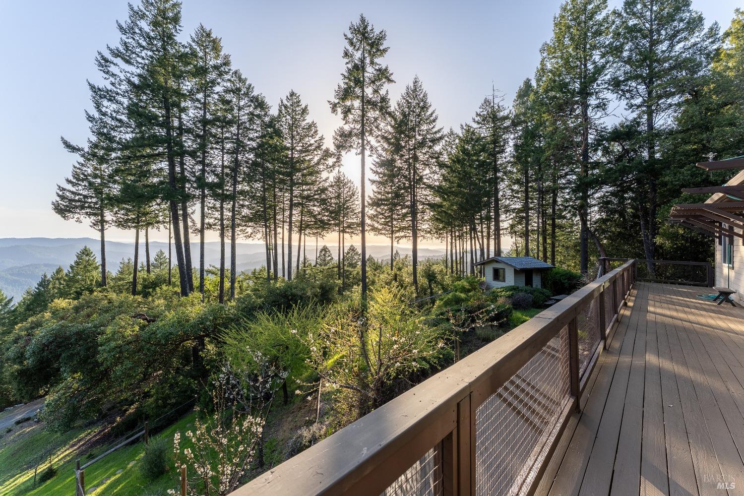 a balcony with trees in front of it