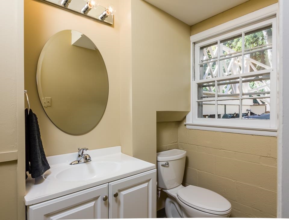 303 West Cornwall Road Cary, NC 27511 - Photo 14 of 22 a bathroom with a sink mirror vanity and toilet