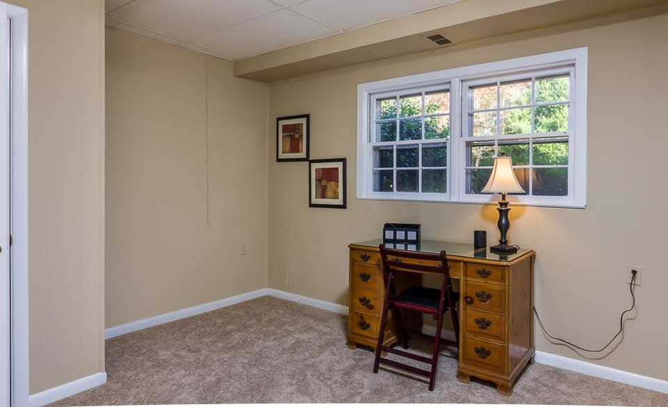 303 West Cornwall Road Cary, NC 27511 - Photo 15 of 22 a view of a workspace with furniture and a window