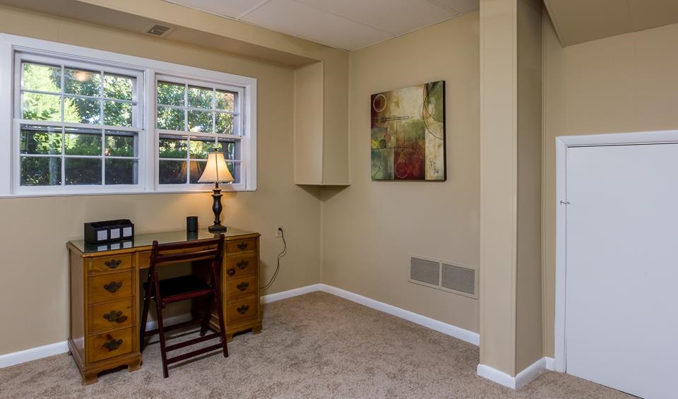 303 West Cornwall Road Cary, NC 27511 - Photo 16 of 22 a view of a workspace with furniture and a window
