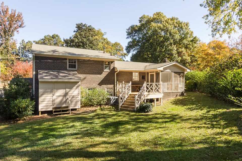 303 West Cornwall Road Cary, NC 27511 - Photo 22 of 22 a front view of a house with a yard table and chairs