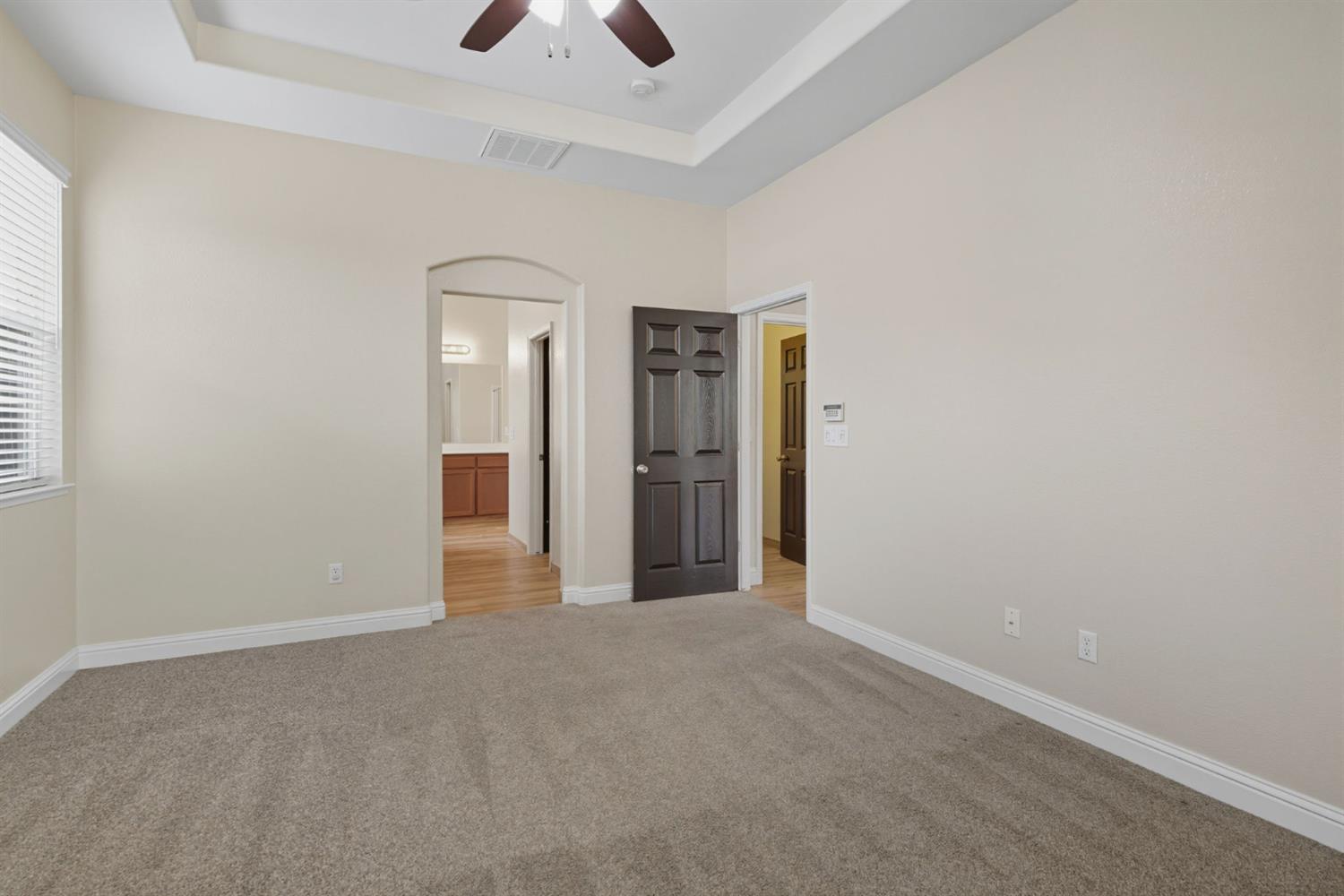 433 Travertine Drive Ripon, CA 95366 - Photo 23 of 38 a view of an empty room with closet and a window