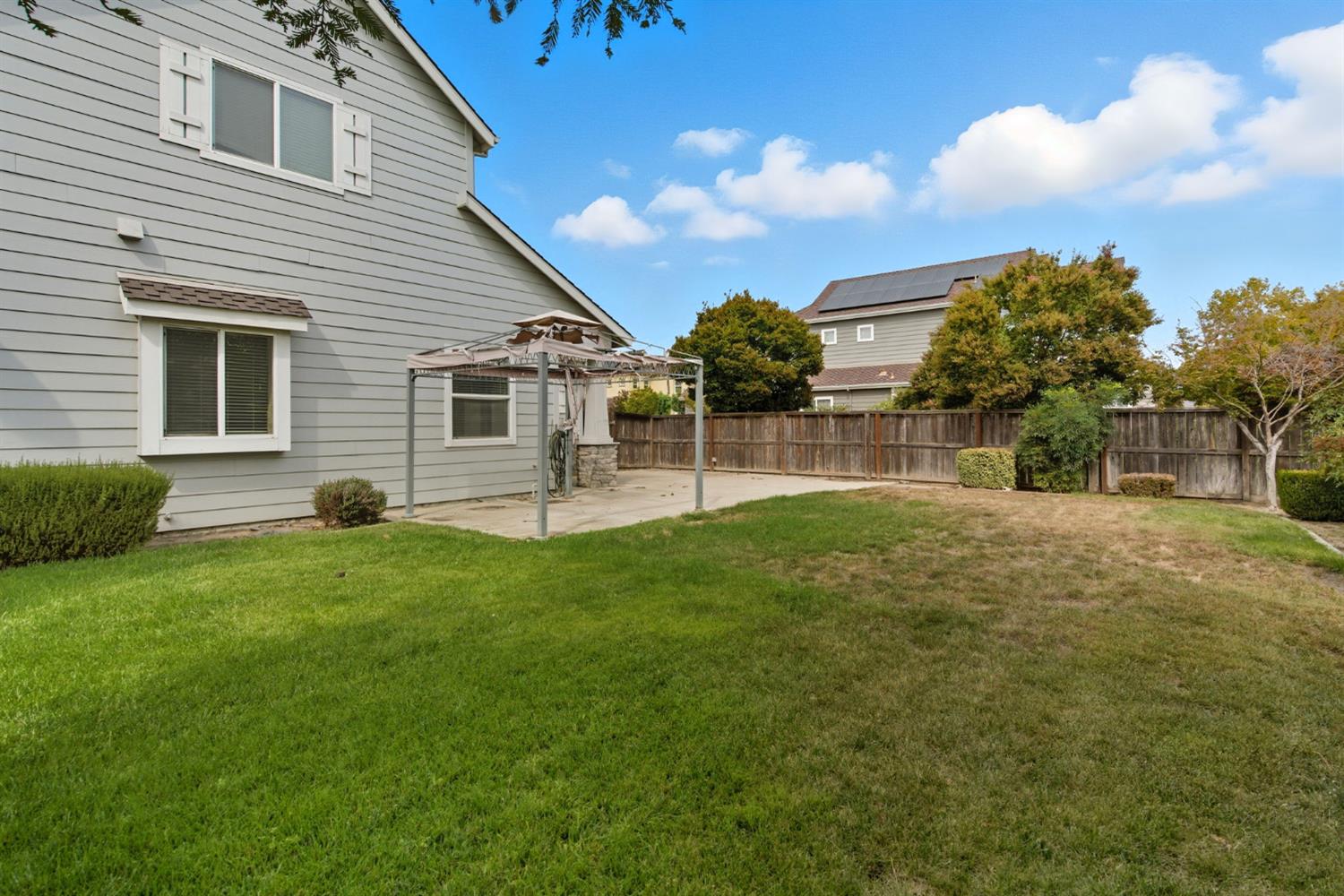 433 Travertine Drive Ripon, CA 95366 - Photo 35 of 38 a view of a house with a backyard