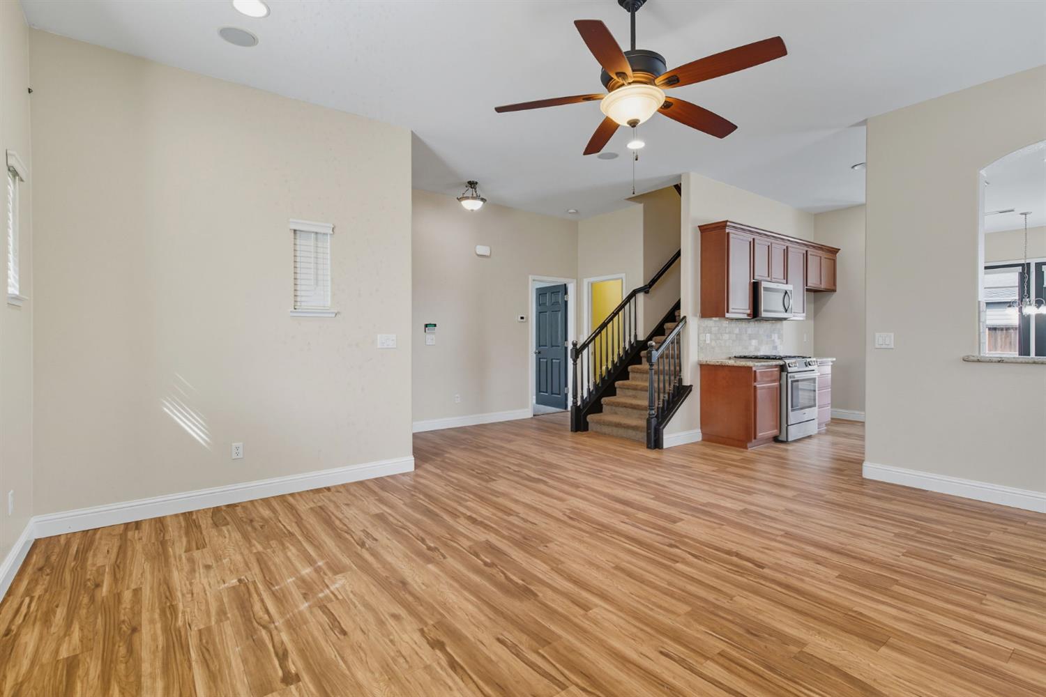 433 Travertine Drive Ripon, CA 95366 - Photo 8 of 38 a view of empty room with wooden floor and fan