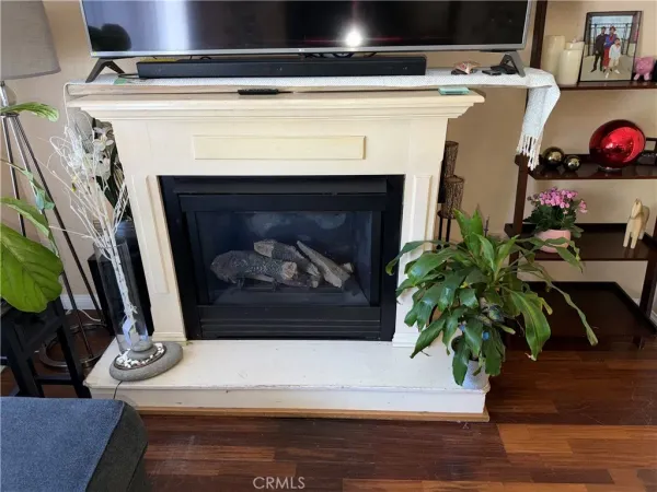 a close view of a fireplace with furniture