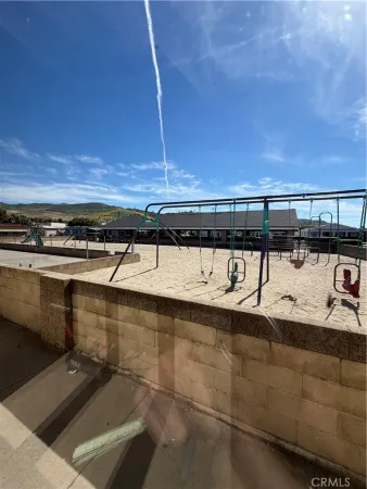 a view of a swimming pool and an outdoor space