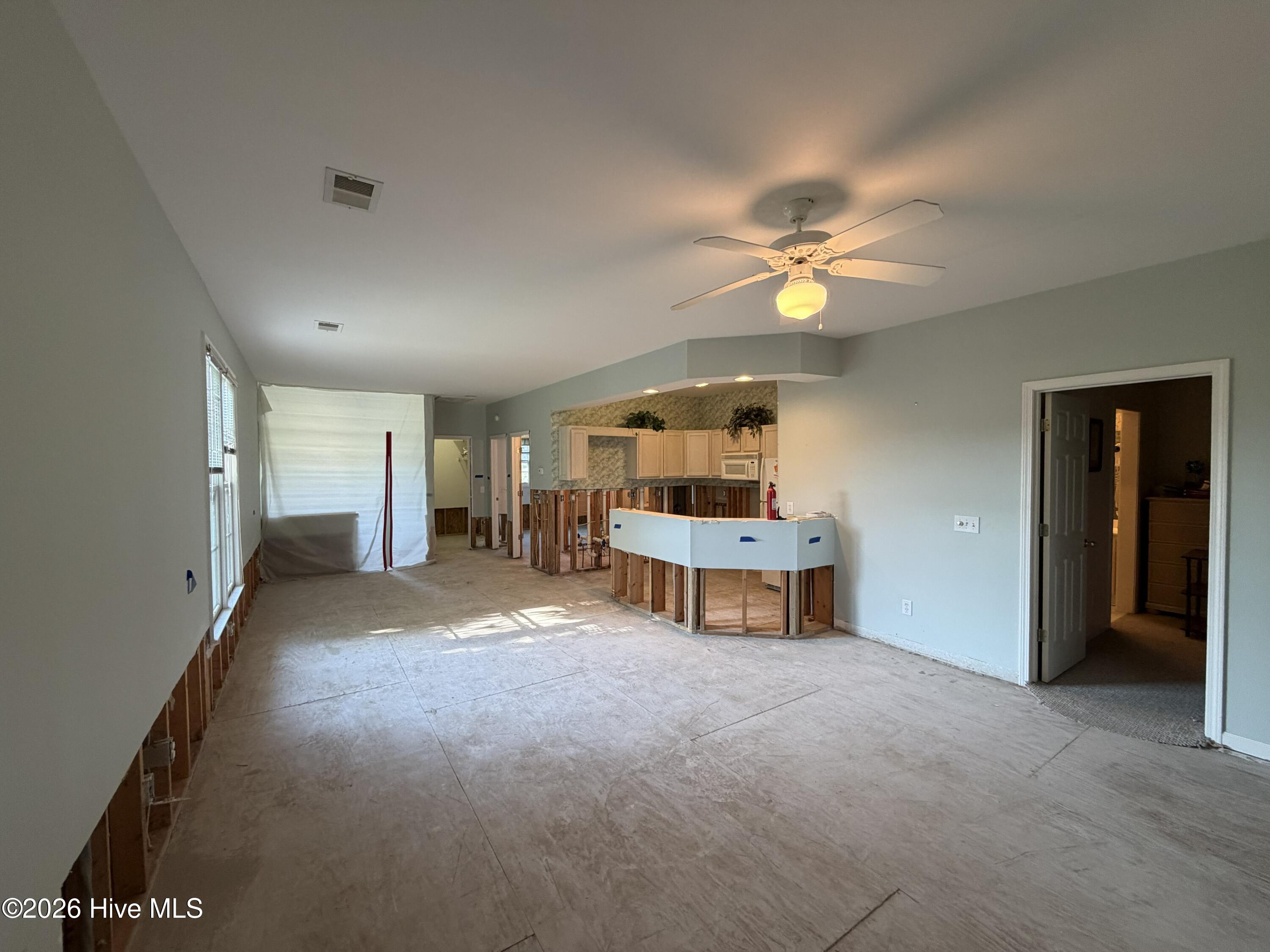 116 Rice Mill Circle, Unit 4 Sunset Beach, NC 28468 - Photo 11 of 29 Kitchen and living/dining areas.