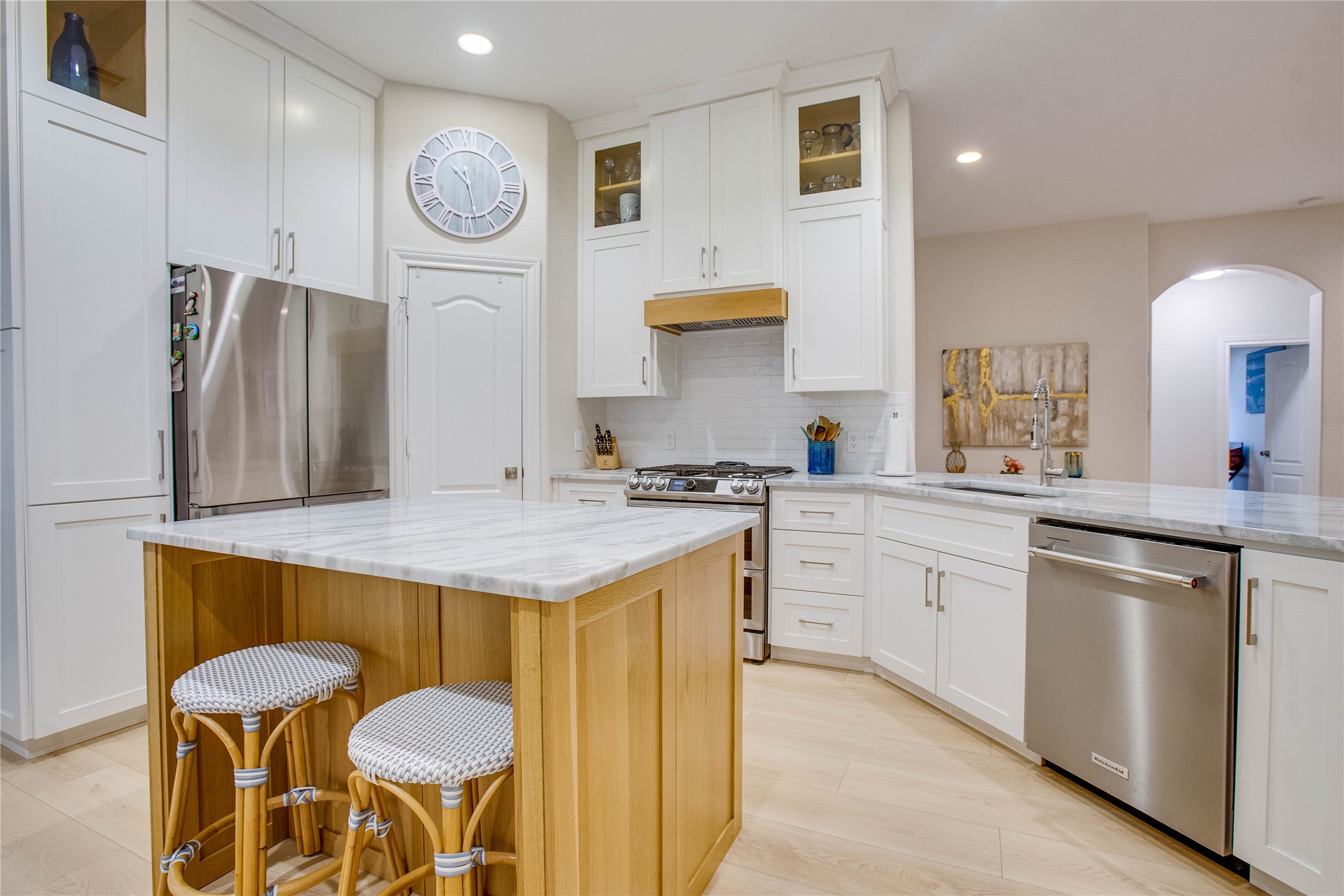 30 Fraiser Fir Place Spring, TX 77389 - Photo 12 of 35 a kitchen with stainless steel appliances granite countertop a sink and a refrigerator
