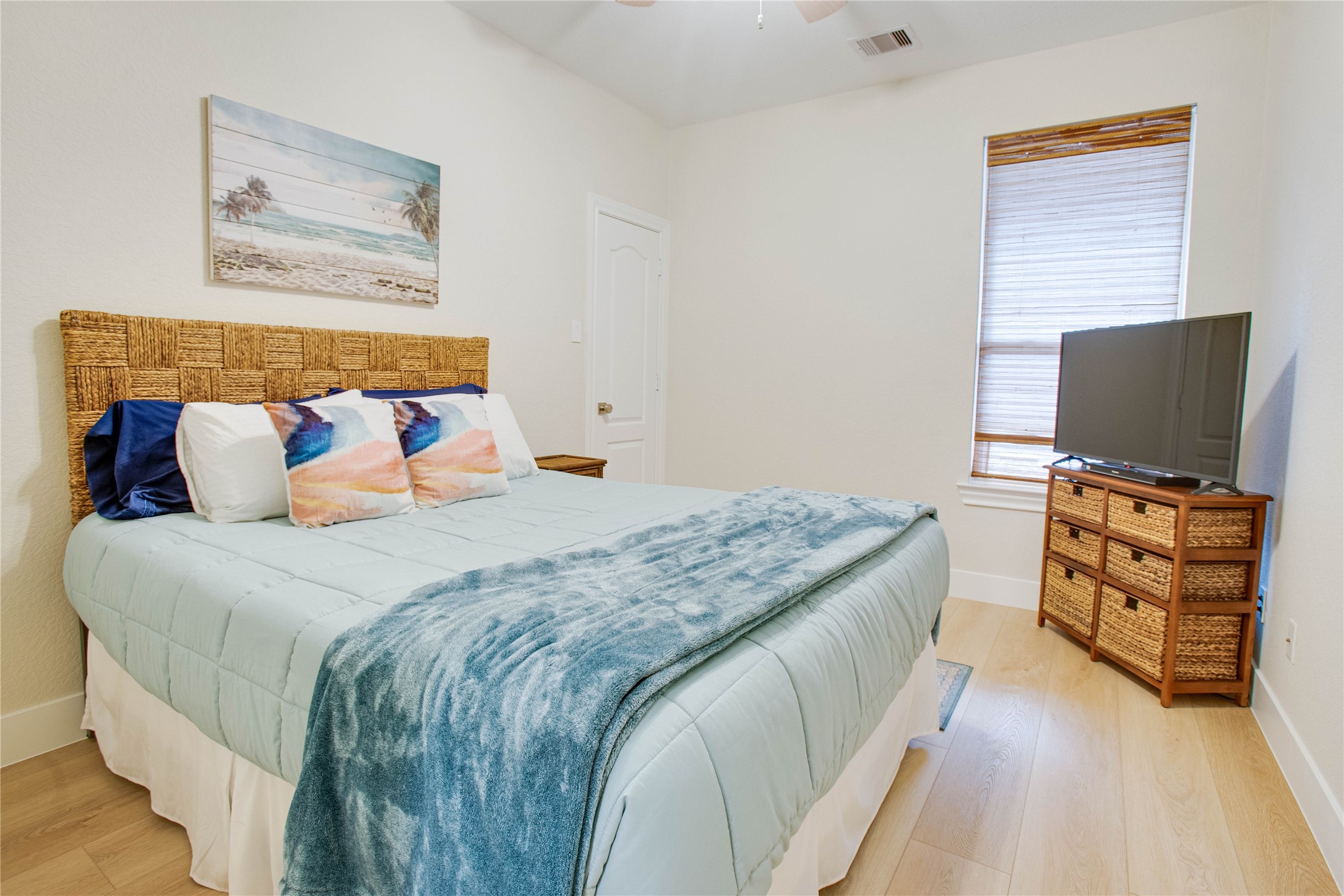 30 Fraiser Fir Place Spring, TX 77389 - Photo 22 of 35 a bedroom with a bed and flat screen tv