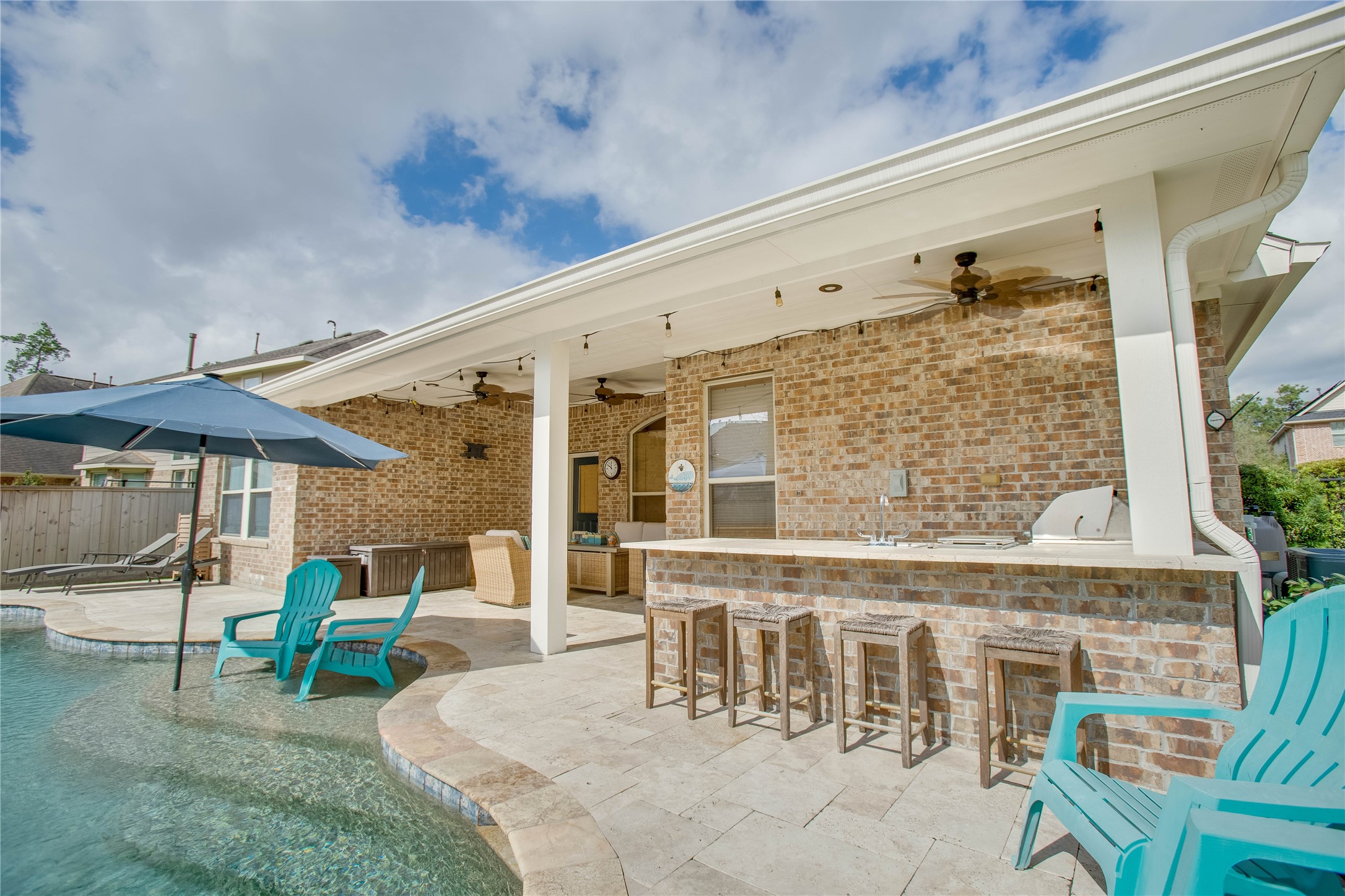 30 Fraiser Fir Place Spring, TX 77389 - Photo 24 of 35 a view of a patio with table and chairs potted plants with wooden floor
