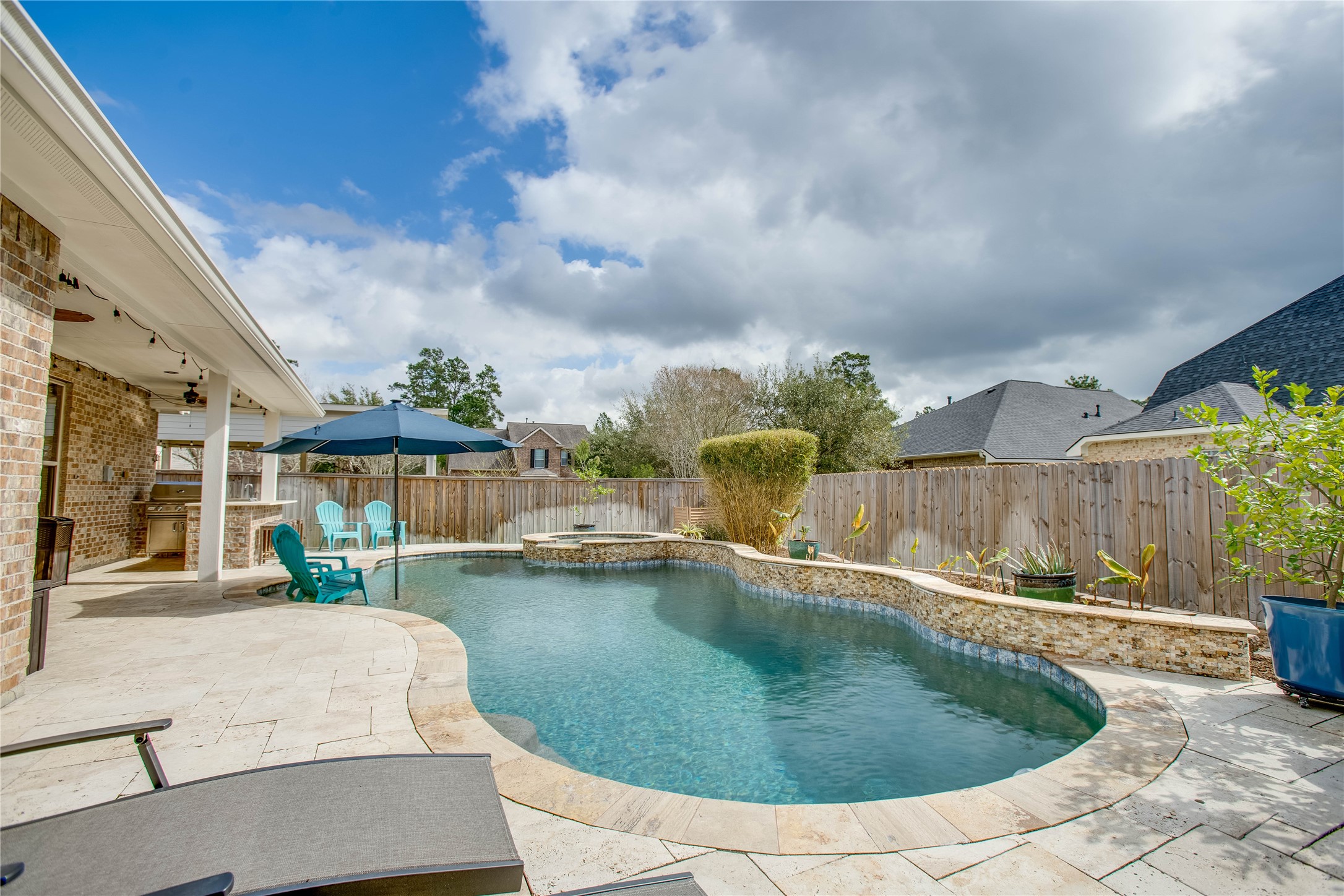 30 Fraiser Fir Place Spring, TX 77389 - Photo 26 of 35 a swimming pool with outdoor seating and yard