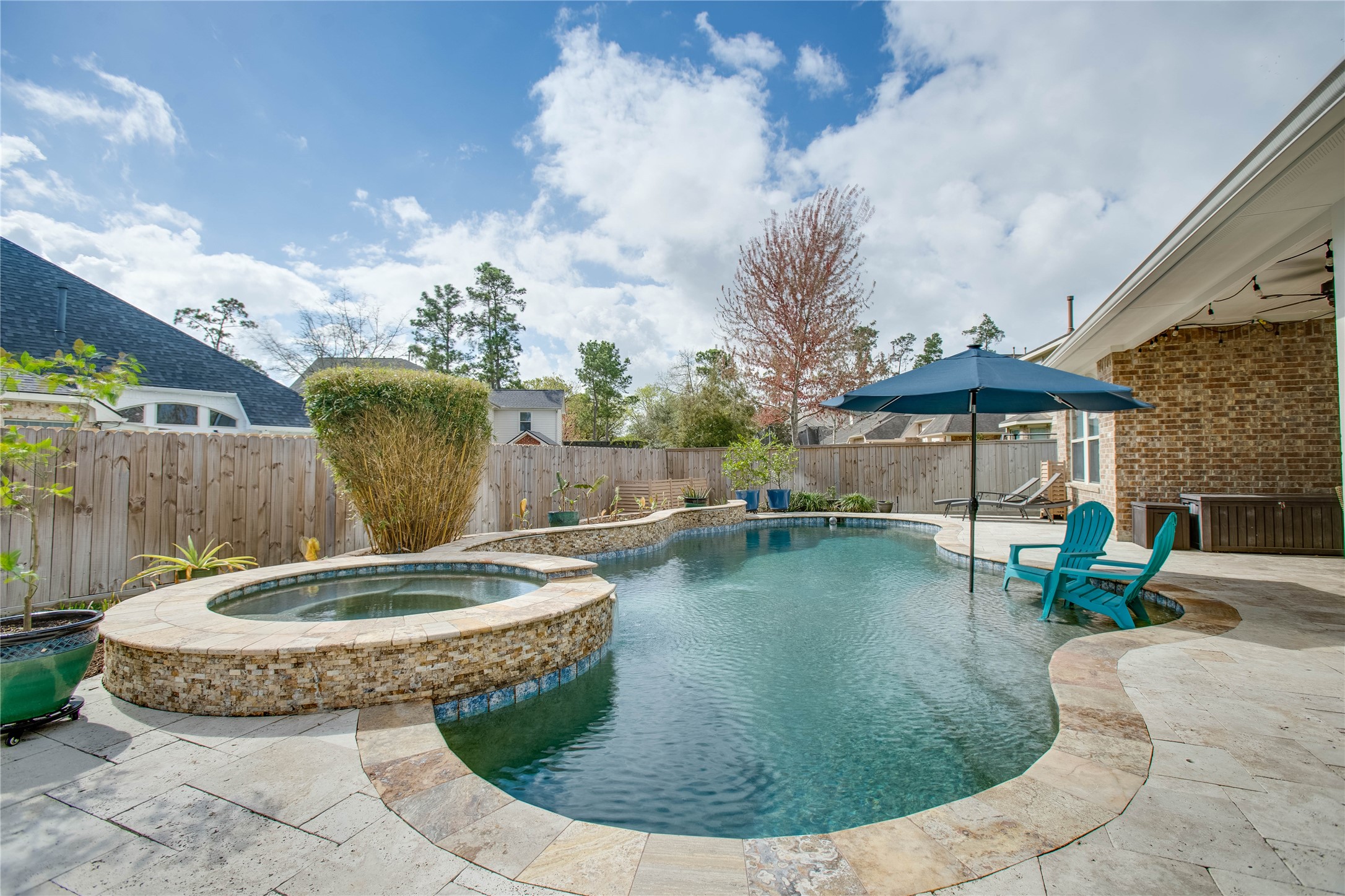 30 Fraiser Fir Place Spring, TX 77389 - Photo 27 of 35 a view of a swimming pool with a patio