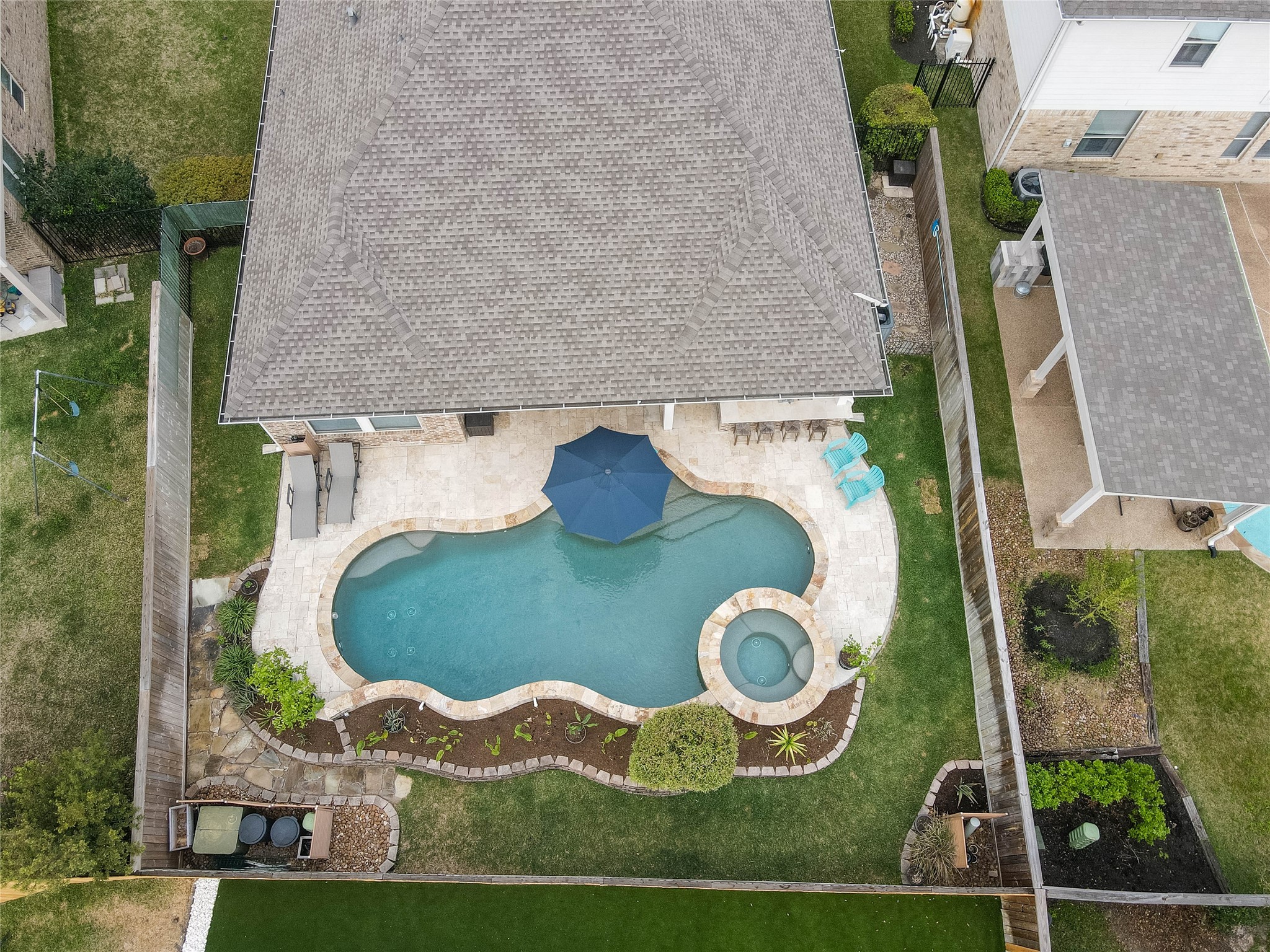 30 Fraiser Fir Place Spring, TX 77389 - Photo 28 of 35 an aerial view of a house with garden space swimming pool and outdoor seating
