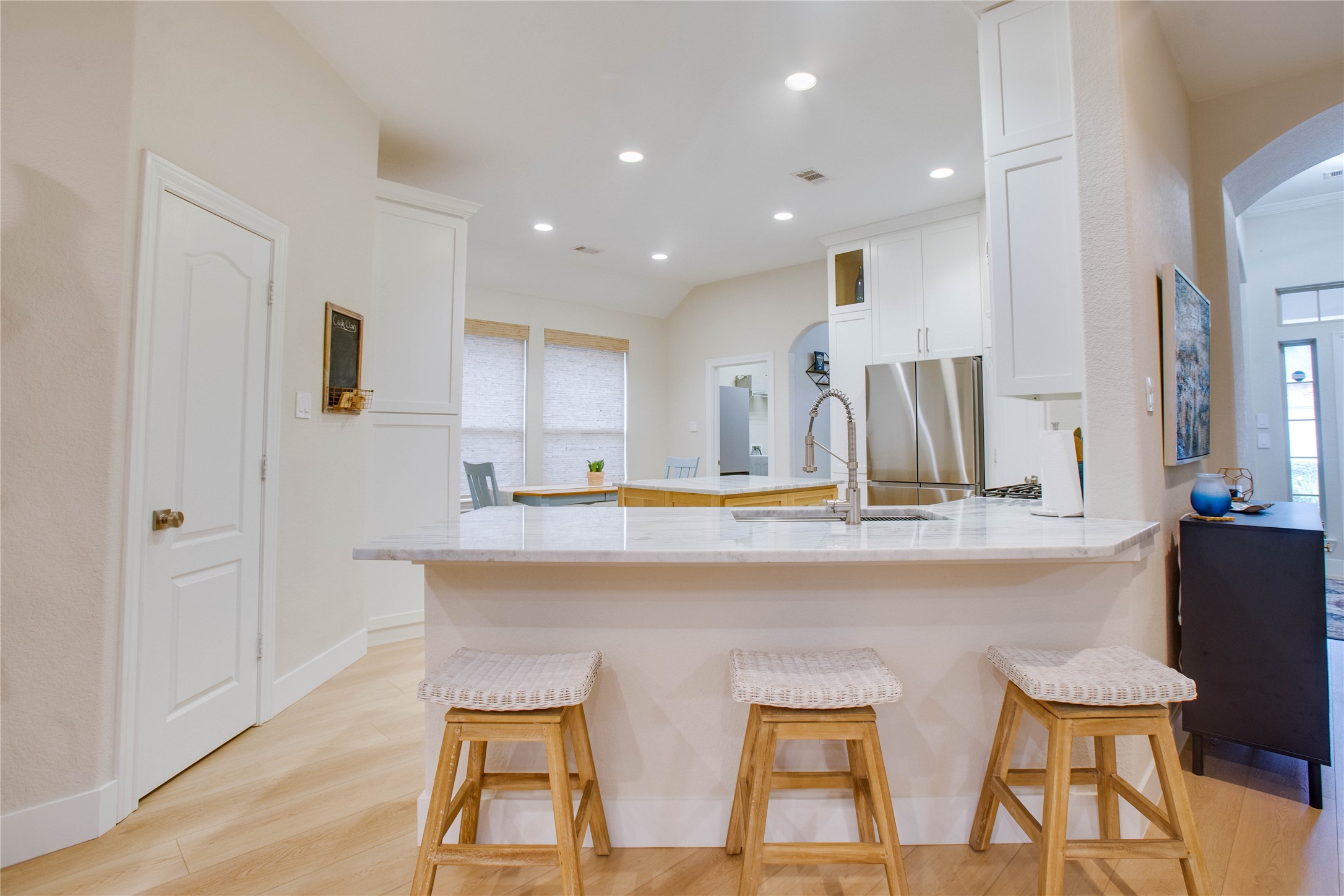 30 Fraiser Fir Place Spring, TX 77389 - Photo 9 of 35 a kitchen with stainless steel appliances granite countertop a sink and a refrigerator