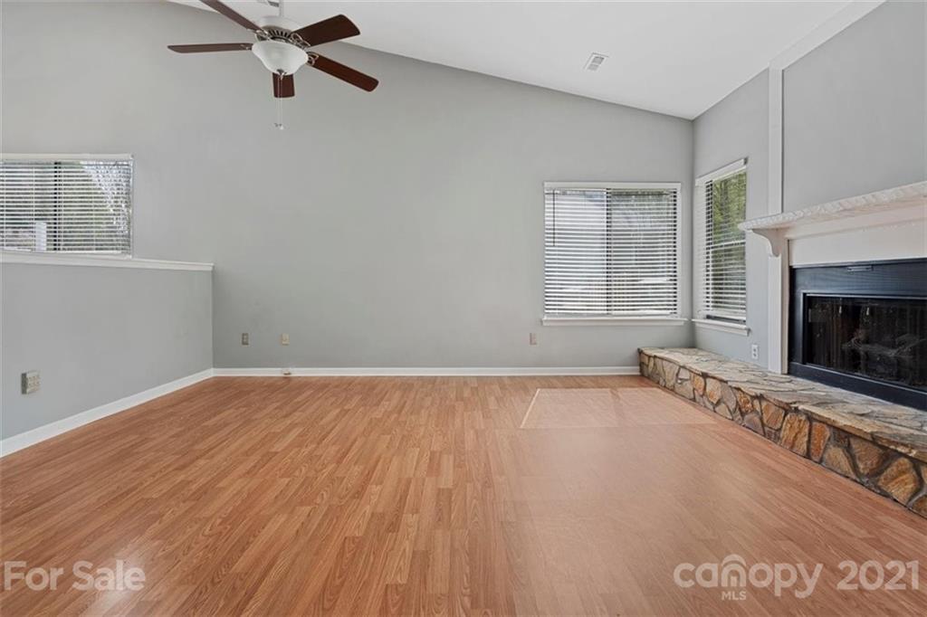8508 Rittenhouse Circle Charlotte, NC 28270 - Photo 17 of 44 a view of an empty room with a fireplace and a window