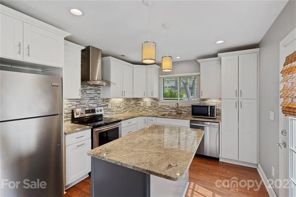 8508 Rittenhouse Circle Charlotte, NC 28270 - Photo 21 of 44 a kitchen with stainless steel appliances granite countertop a sink stove and refrigerator