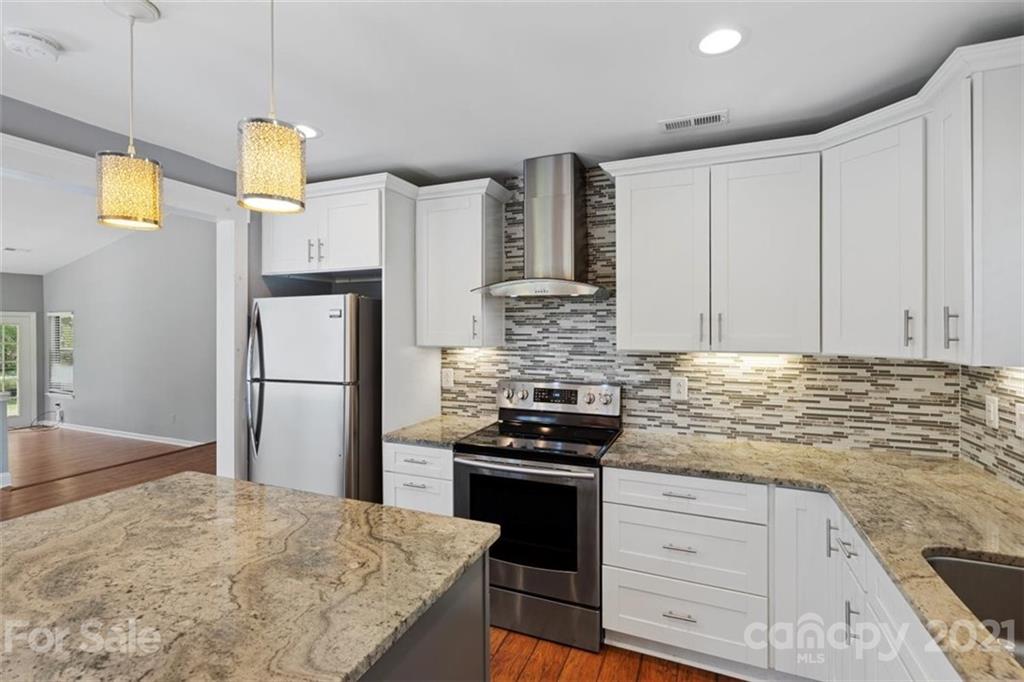 8508 Rittenhouse Circle Charlotte, NC 28270 - Photo 22 of 44 a kitchen with stainless steel appliances granite countertop a stove a refrigerator and a sink