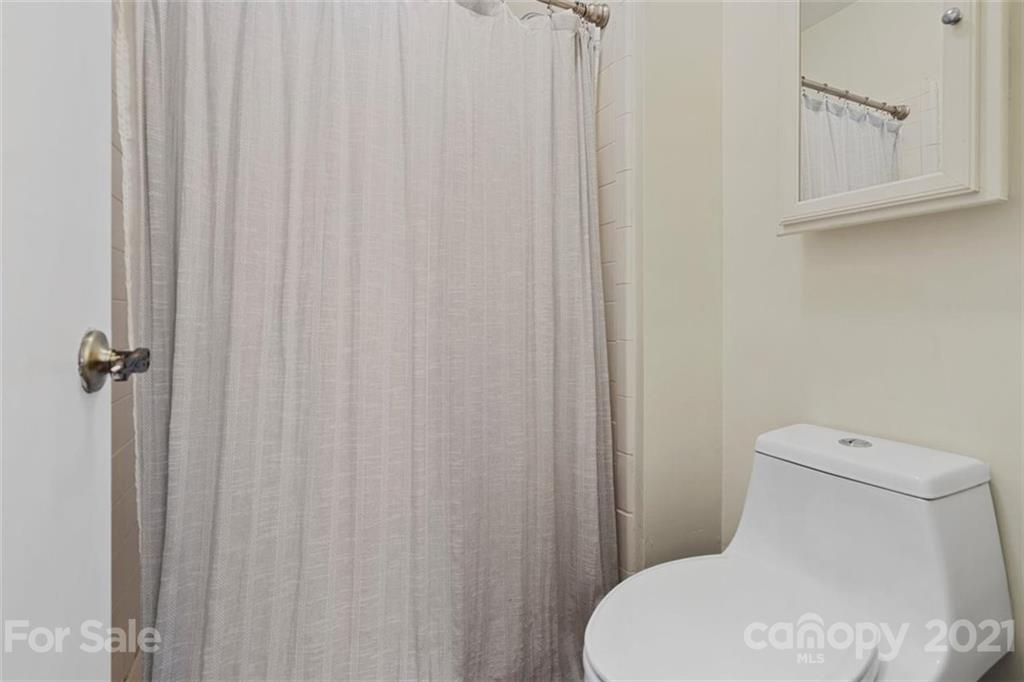 8508 Rittenhouse Circle Charlotte, NC 28270 - Photo 32 of 44 a white toilet sitting next to a small sink