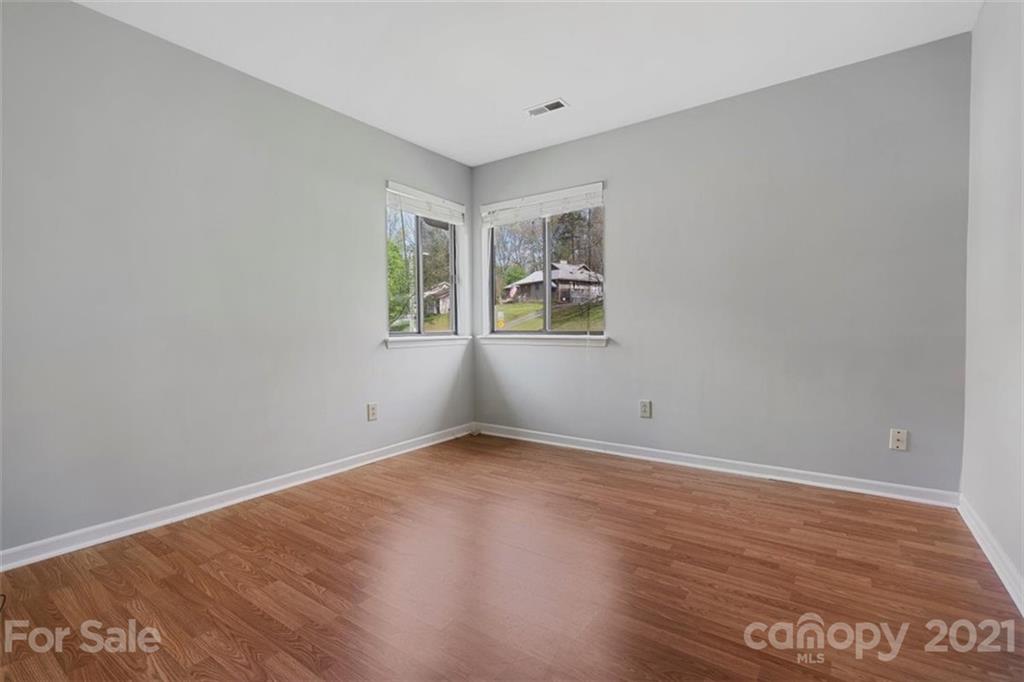 8508 Rittenhouse Circle Charlotte, NC 28270 - Photo 33 of 44 a view of an empty room with wooden floor and a window
