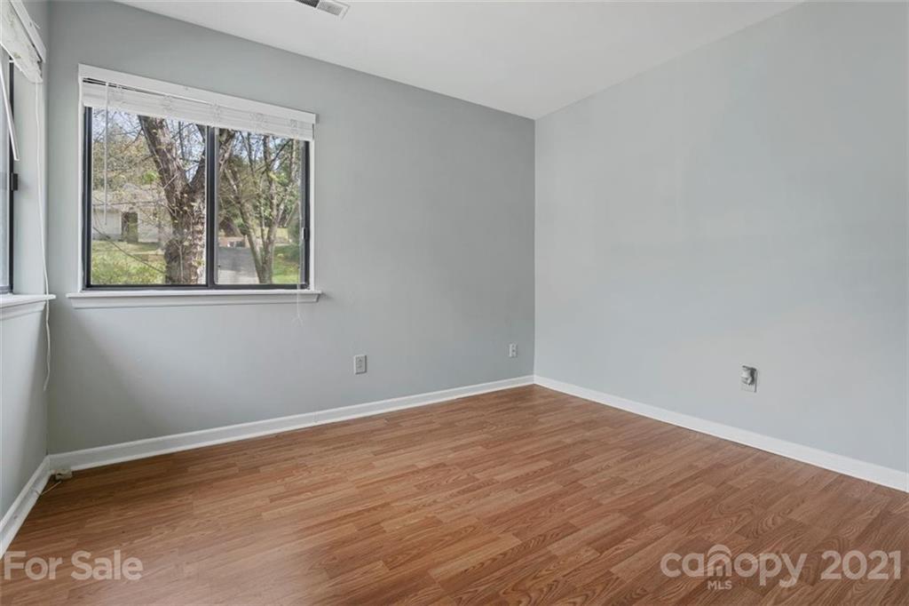 8508 Rittenhouse Circle Charlotte, NC 28270 - Photo 34 of 44 a view of an empty room with wooden floor and a window