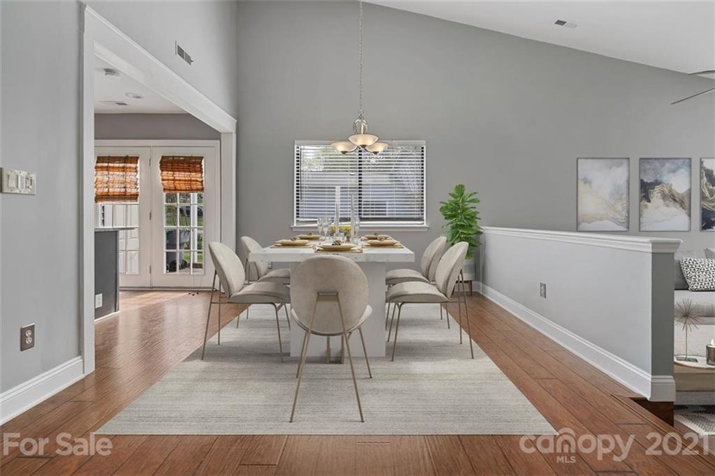 8508 Rittenhouse Circle Charlotte, NC 28270 - Photo 8 of 44 a view of a dining room with furniture wooden floor and a chandelier