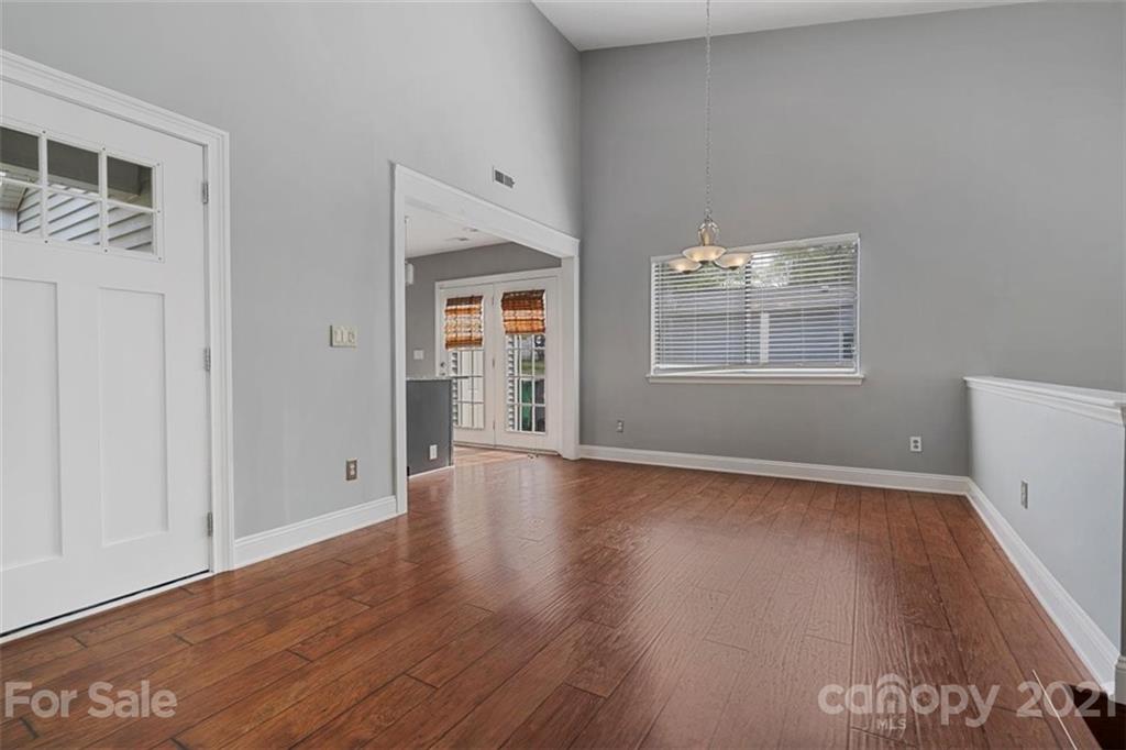 8508 Rittenhouse Circle Charlotte, NC 28270 - Photo 10 of 44 an empty room with wooden floor and windows
