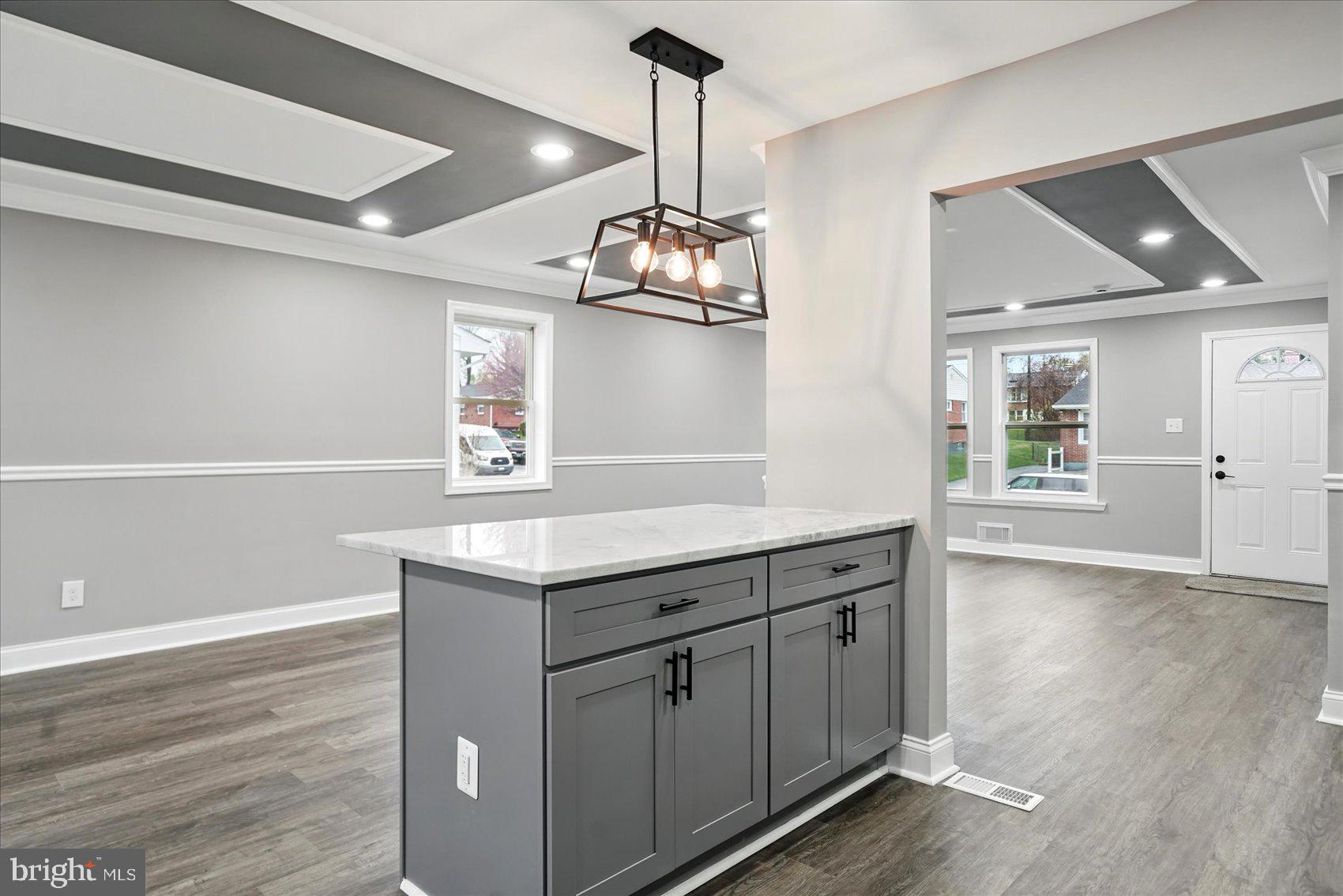 3816 Cherrybrook Road Randallstown, MD 21133 - Photo 11 of 35 a kitchen with a wooden floor and window