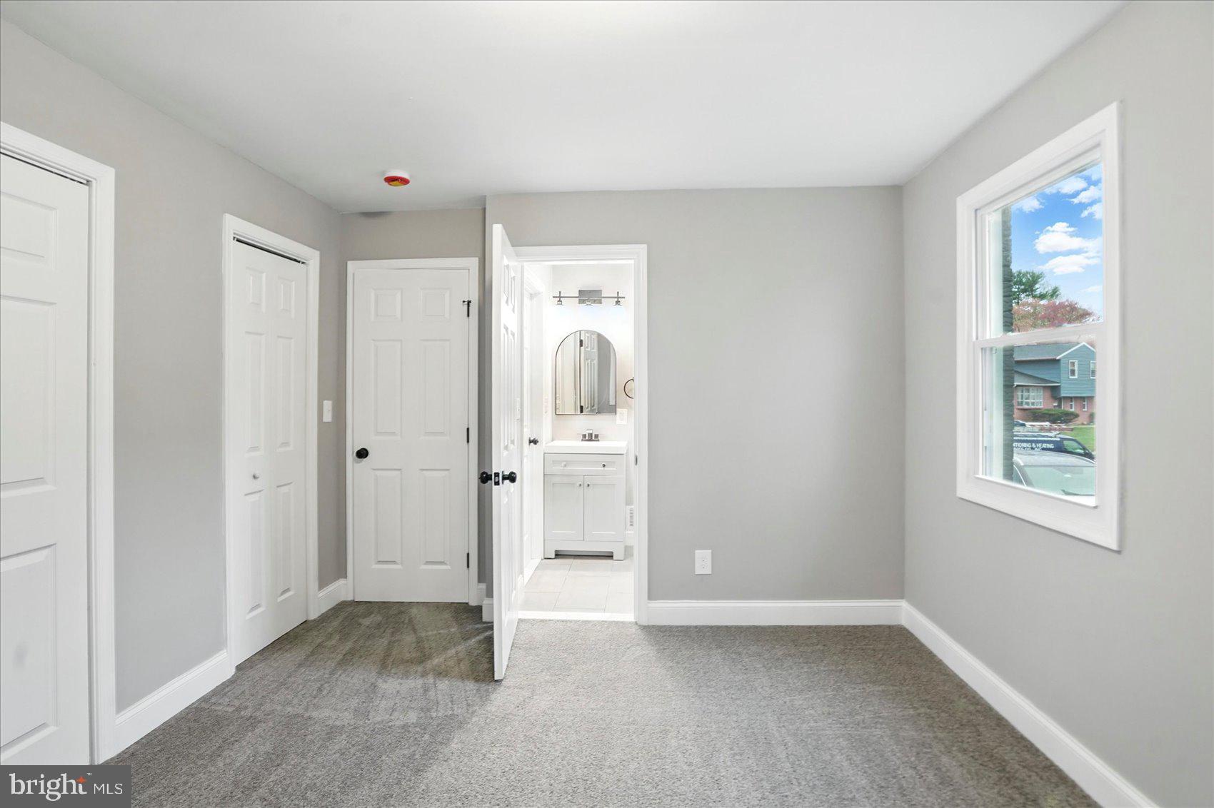 3816 Cherrybrook Road Randallstown, MD 21133 - Photo 14 of 35 an empty room with windows and closet