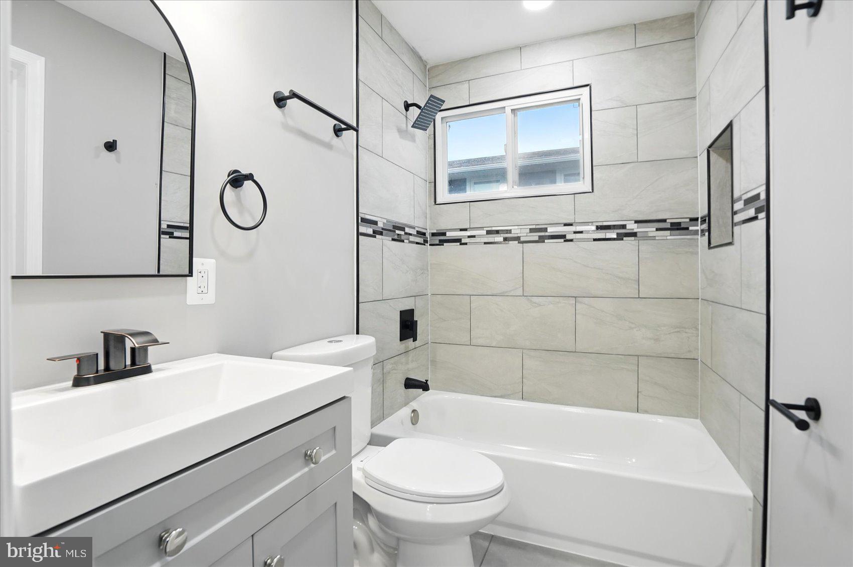 3816 Cherrybrook Road Randallstown, MD 21133 - Photo 16 of 35 a bathroom with a sink a toilet and shower