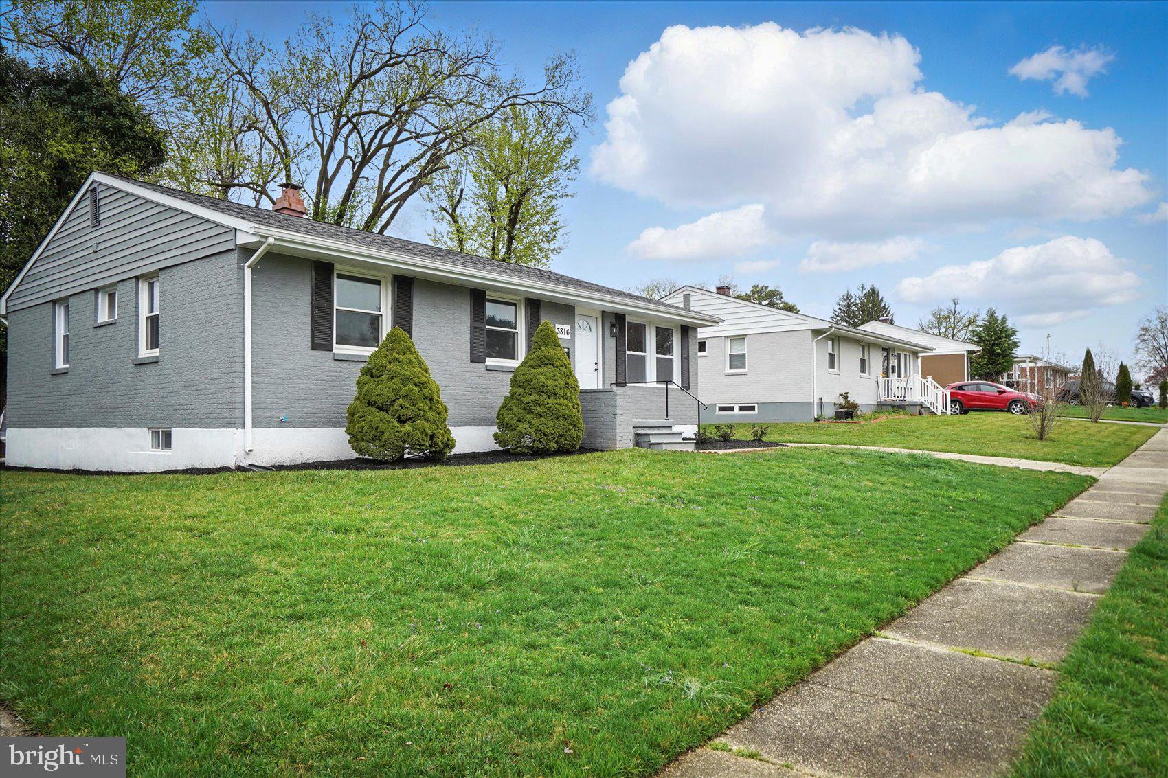 3816 Cherrybrook Road Randallstown, MD 21133 - Photo 2 of 35 a view of a yard in front of a house with large trees