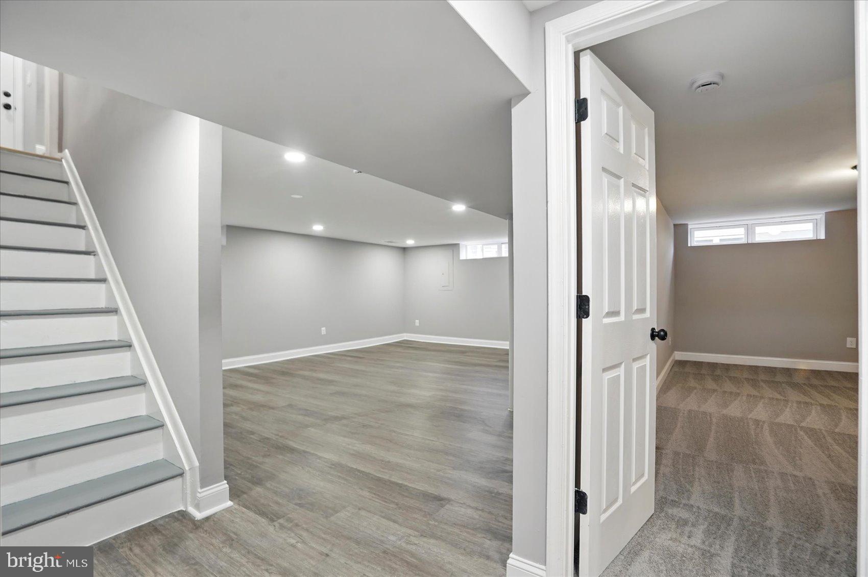 3816 Cherrybrook Road Randallstown, MD 21133 - Photo 21 of 35 a view of a hallway with wooden floor and staircase