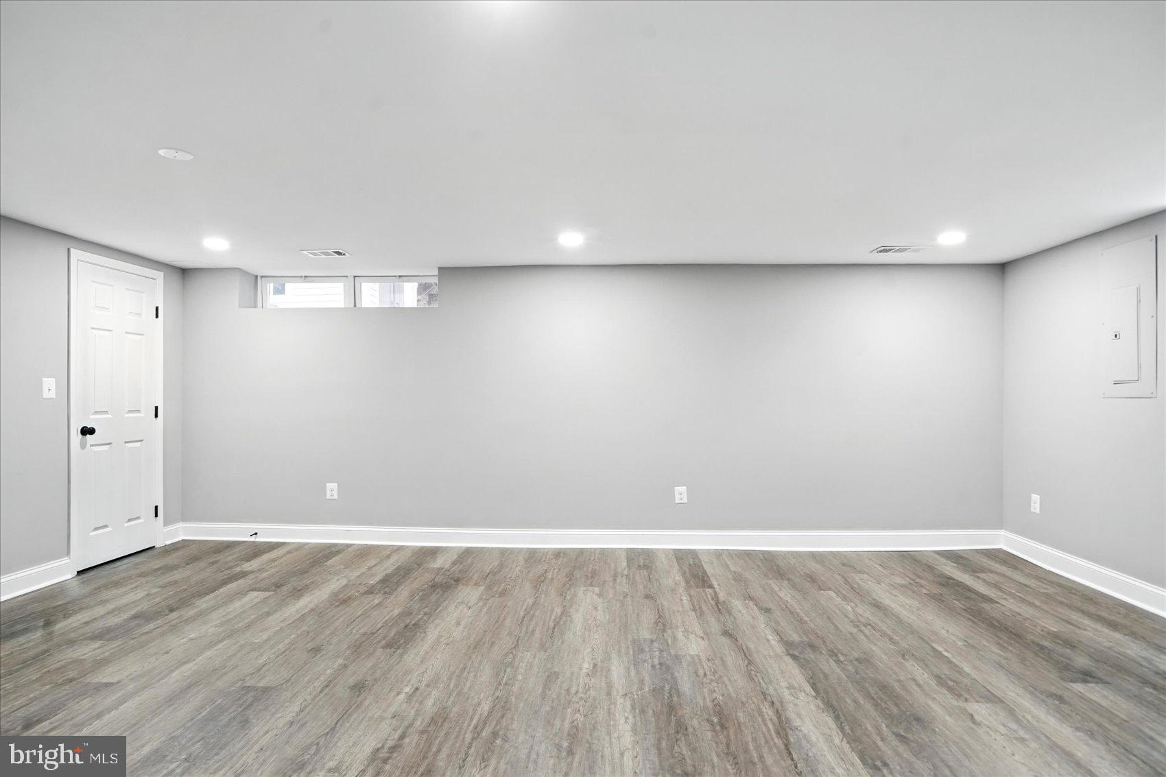 3816 Cherrybrook Road Randallstown, MD 21133 - Photo 23 of 35 a view of an empty room with wooden floor