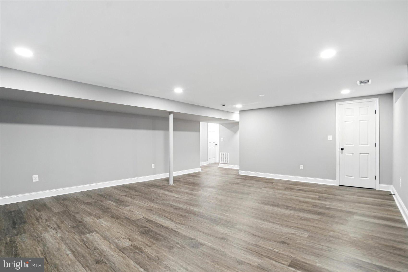 3816 Cherrybrook Road Randallstown, MD 21133 - Photo 24 of 35 a view of an empty room with wooden floor