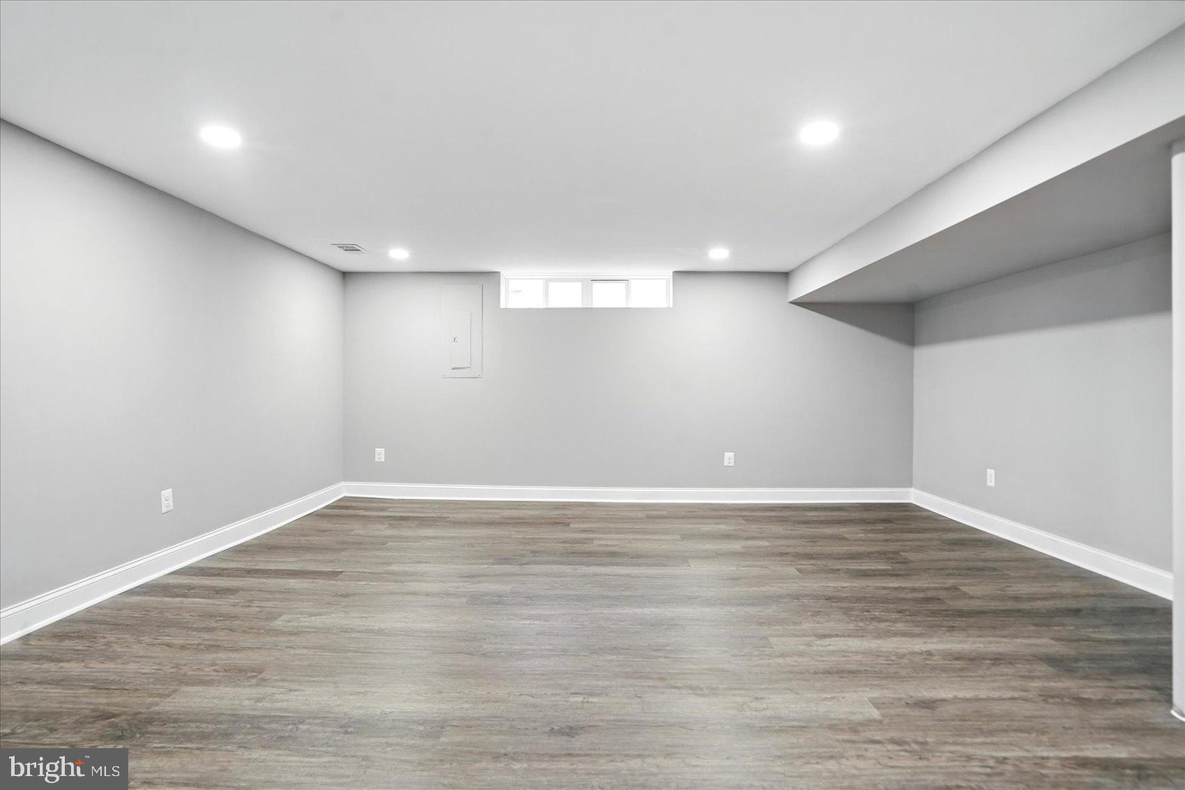 3816 Cherrybrook Road Randallstown, MD 21133 - Photo 25 of 35 a view of an empty room with wooden floor