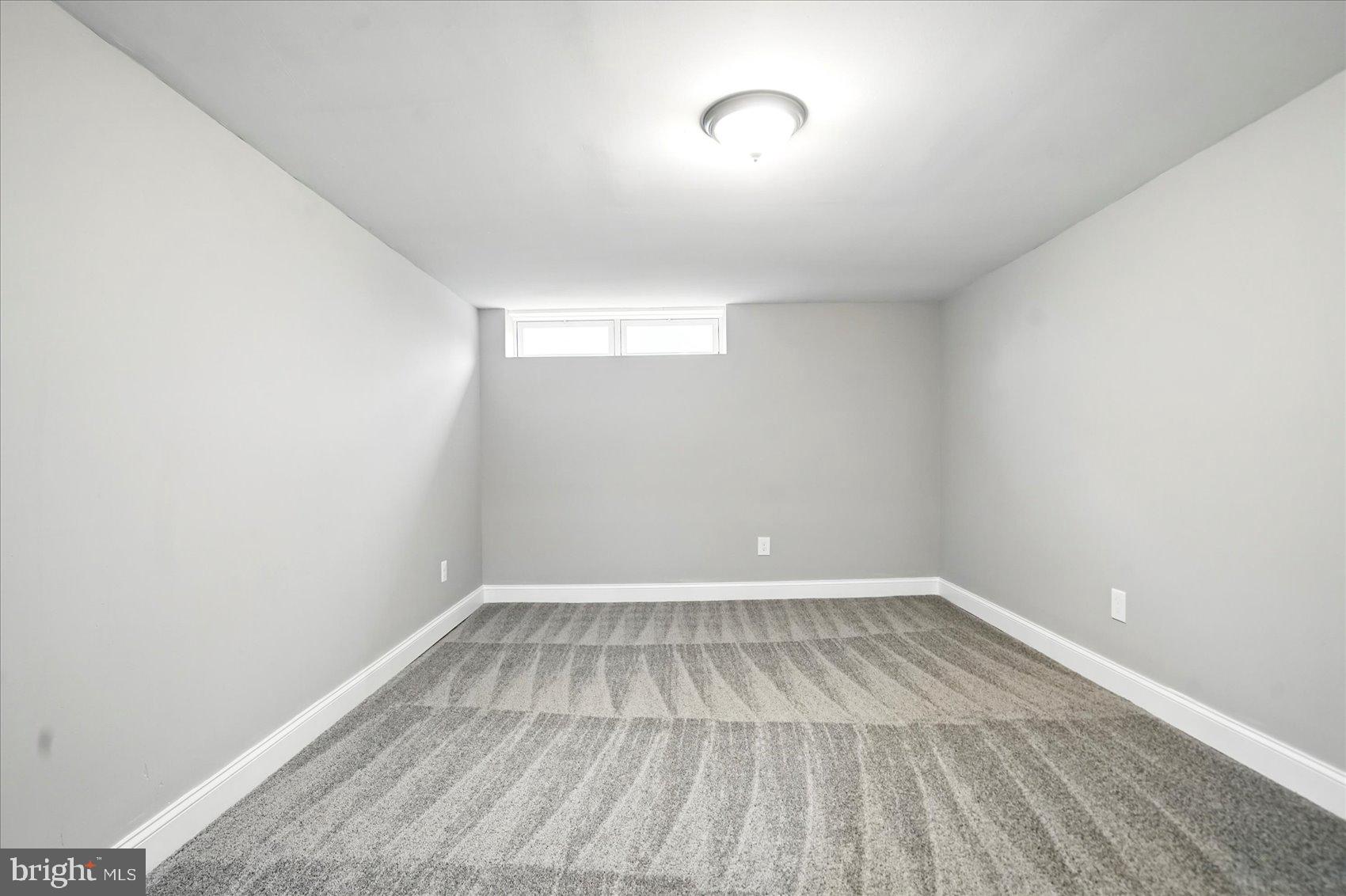 3816 Cherrybrook Road Randallstown, MD 21133 - Photo 28 of 35 a view of a room with wooden floor and brick walls