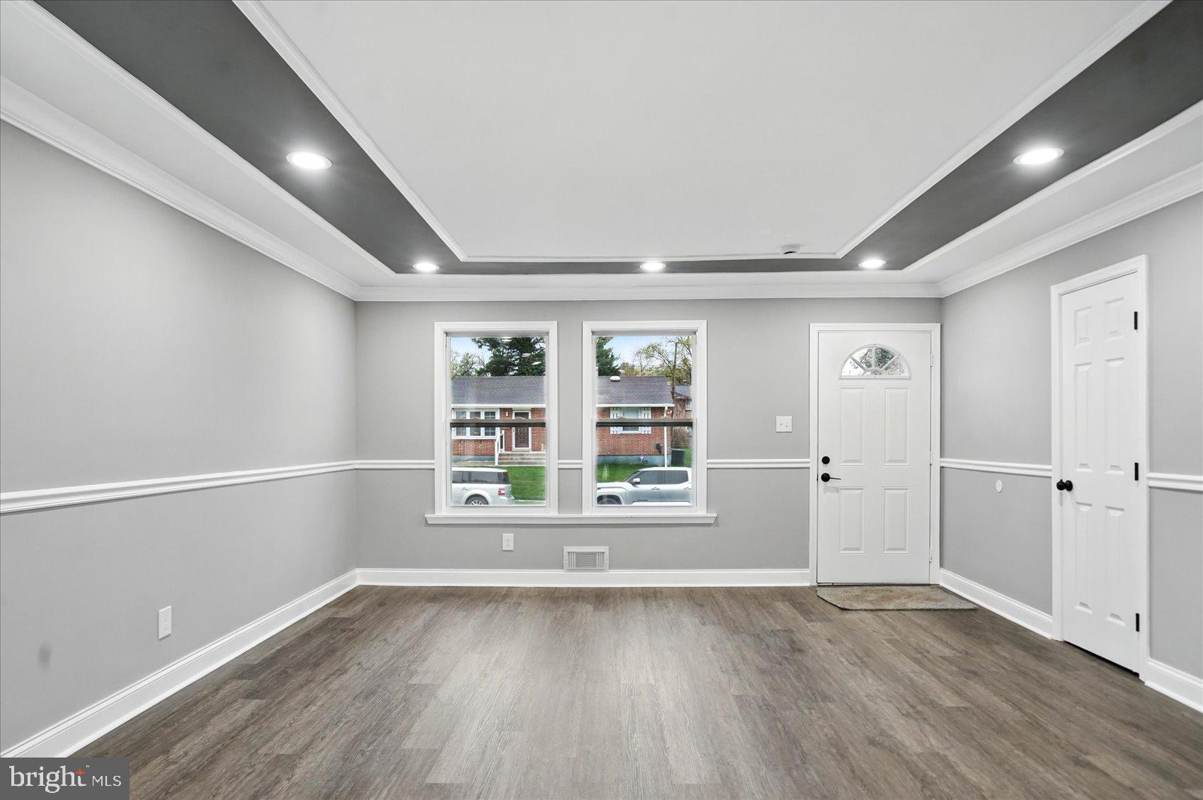 3816 Cherrybrook Road Randallstown, MD 21133 - Photo 3 of 35 wooden floor in an empty room with a window