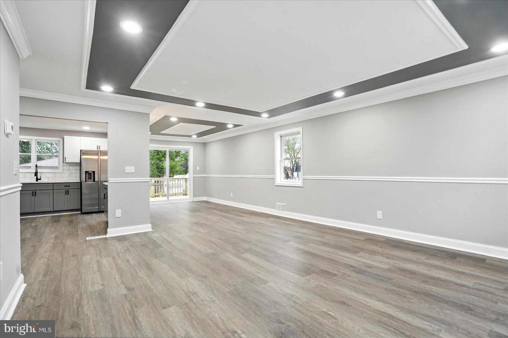 3816 Cherrybrook Road Randallstown, MD 21133 - Photo 4 of 35 a view of a big room with wooden floors and windows