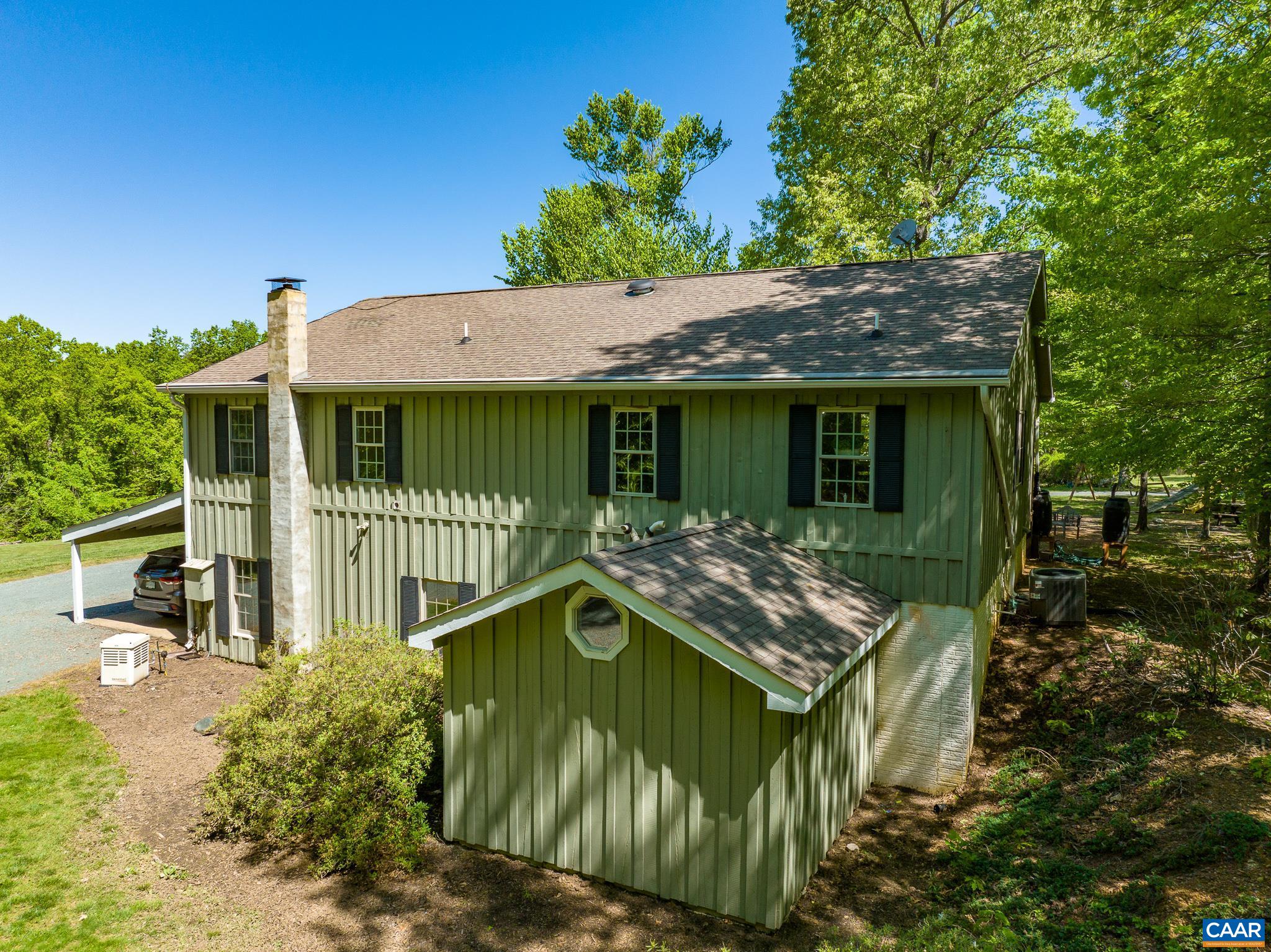 5920 Mechunk Ridge Lane Keswick, VA 22947 - Photo 44 of 49 a house view with a garden space
