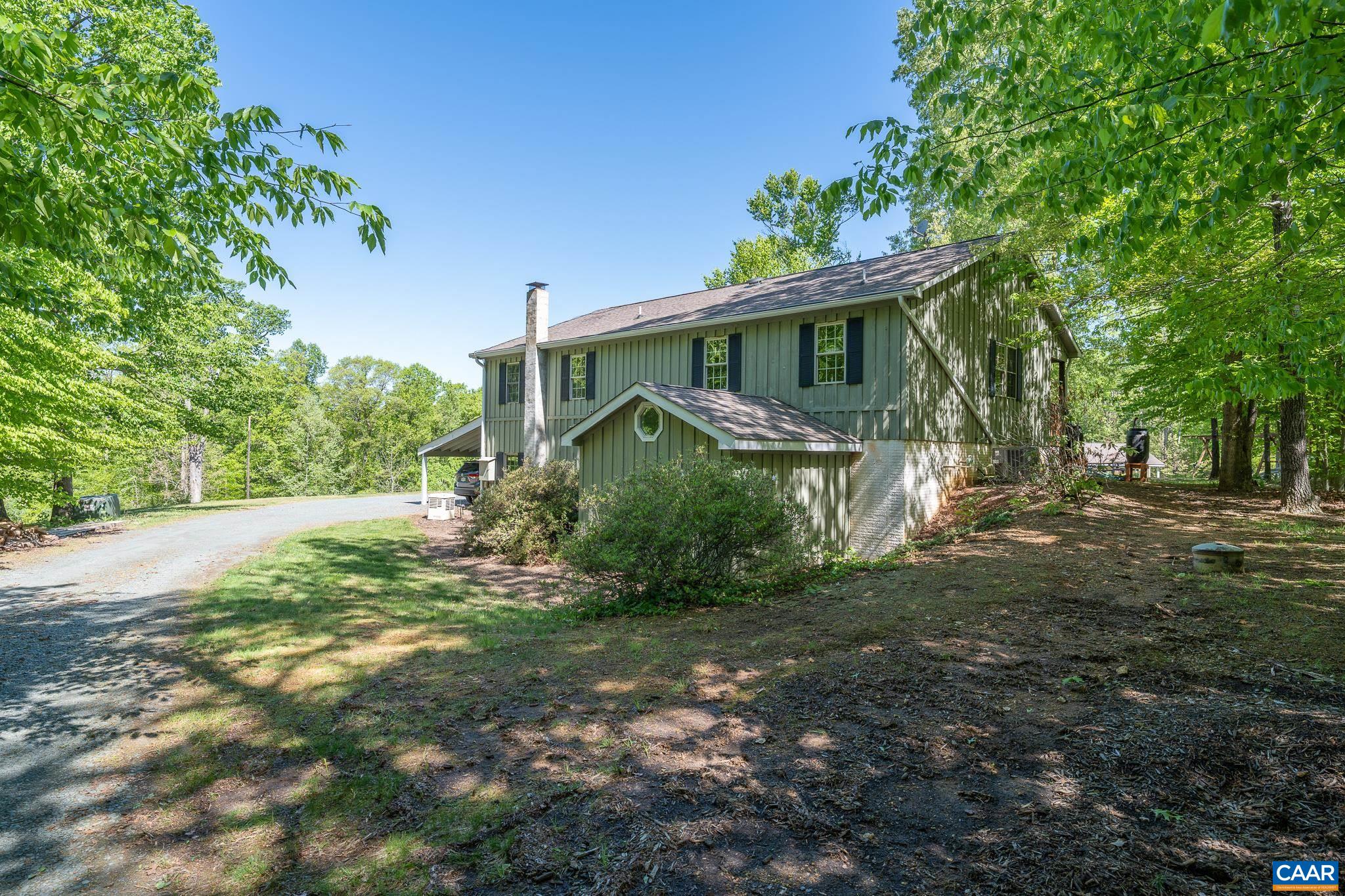 5920 Mechunk Ridge Lane Keswick, VA 22947 - Photo 46 of 49 a view of a house with a yard
