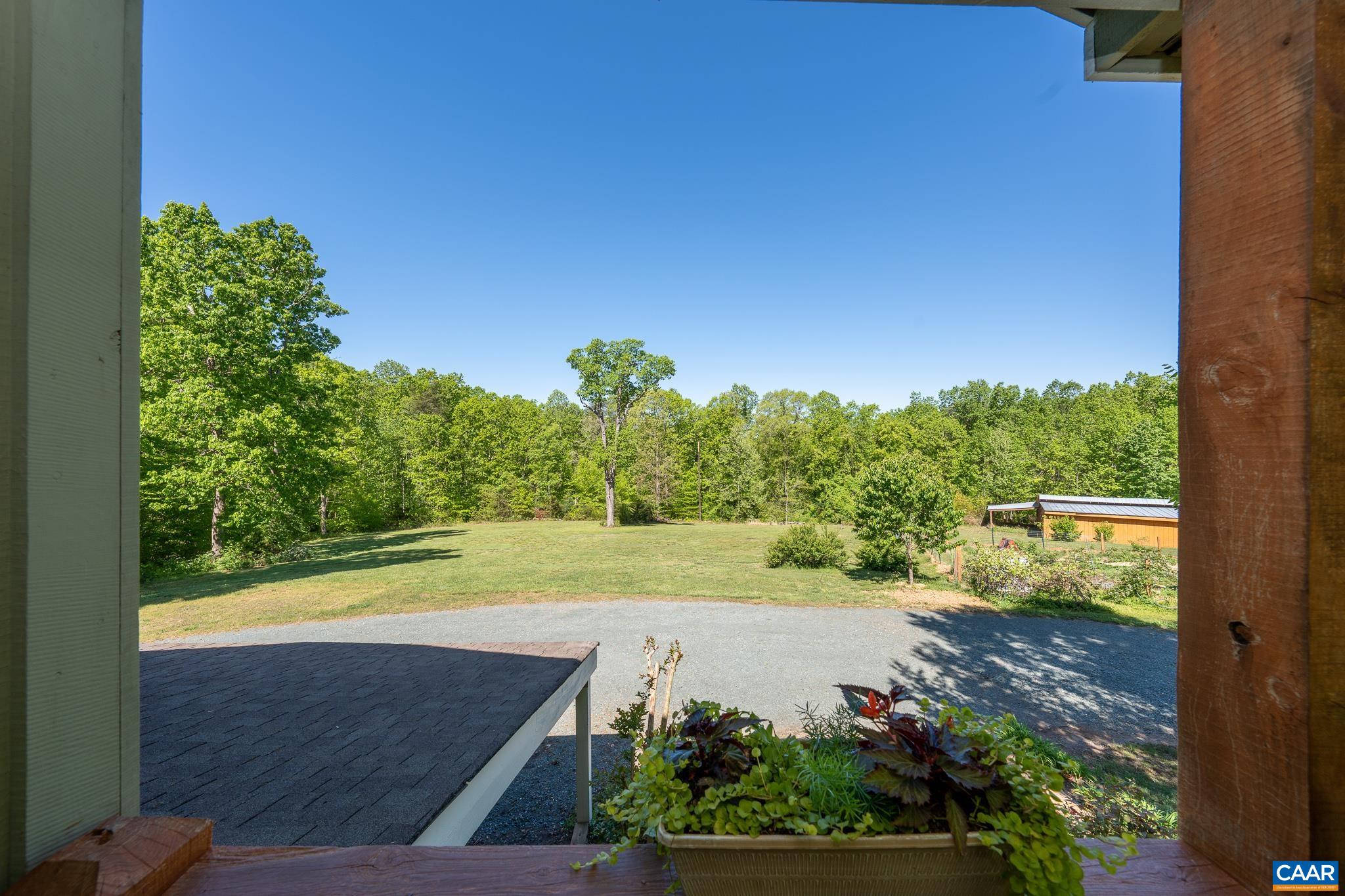 5920 Mechunk Ridge Lane Keswick, VA 22947 - Photo 5 of 49 a view of a swimming pool with a yard