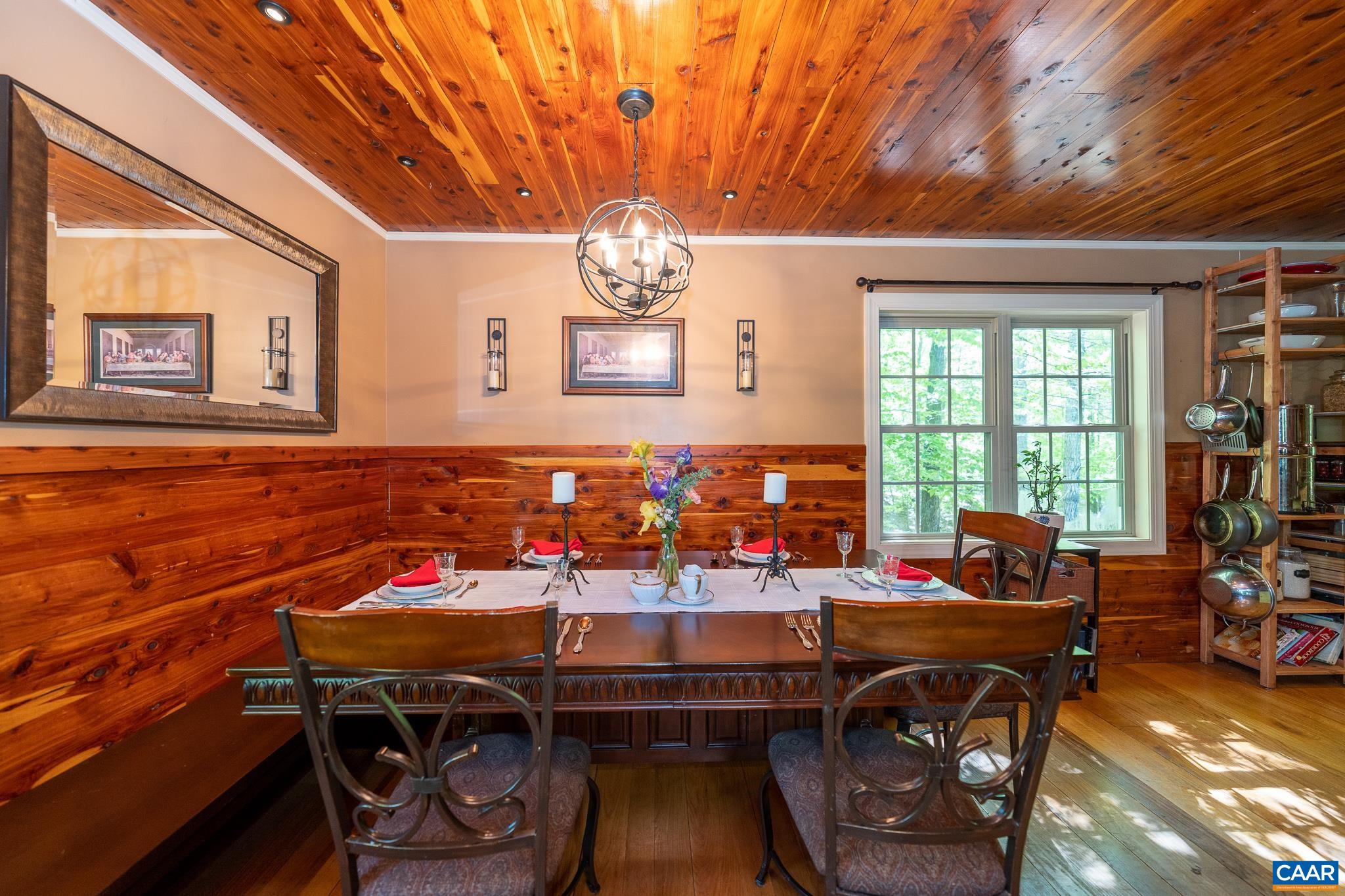 5920 Mechunk Ridge Lane Keswick, VA 22947 - Photo 8 of 49 a view of a dining room with furniture and chandelier