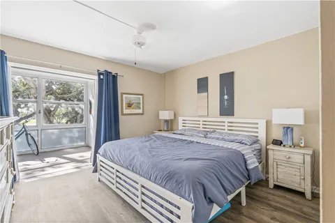 a bedroom with a bed and a cabinets