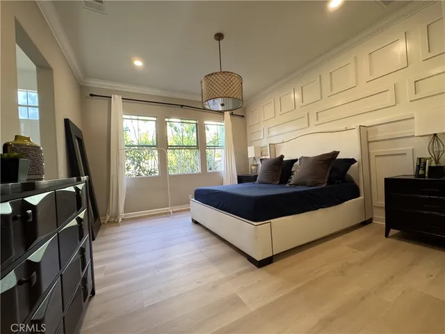 a living room with furniture a window and a flat screen tv