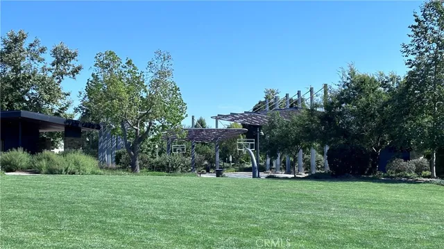 a view of a backyard with a sitting area and slide