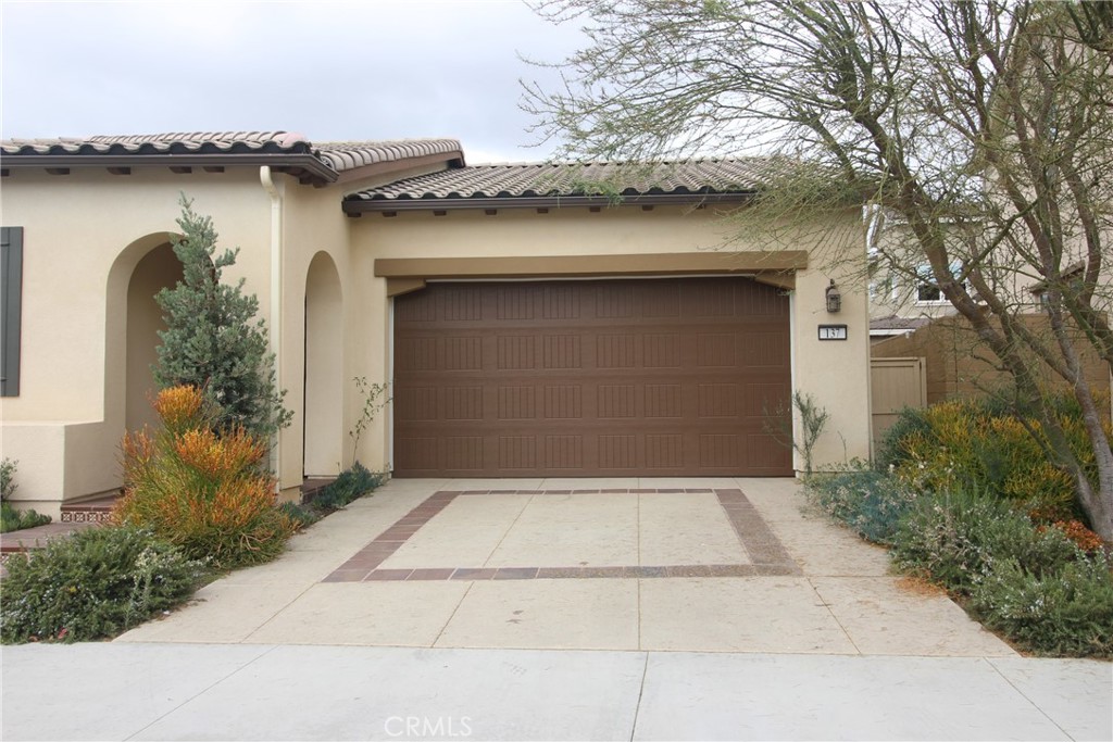 137 Smallwheel Irvine, CA 92618 - Photo 4 of 49 a front view of a house with plants