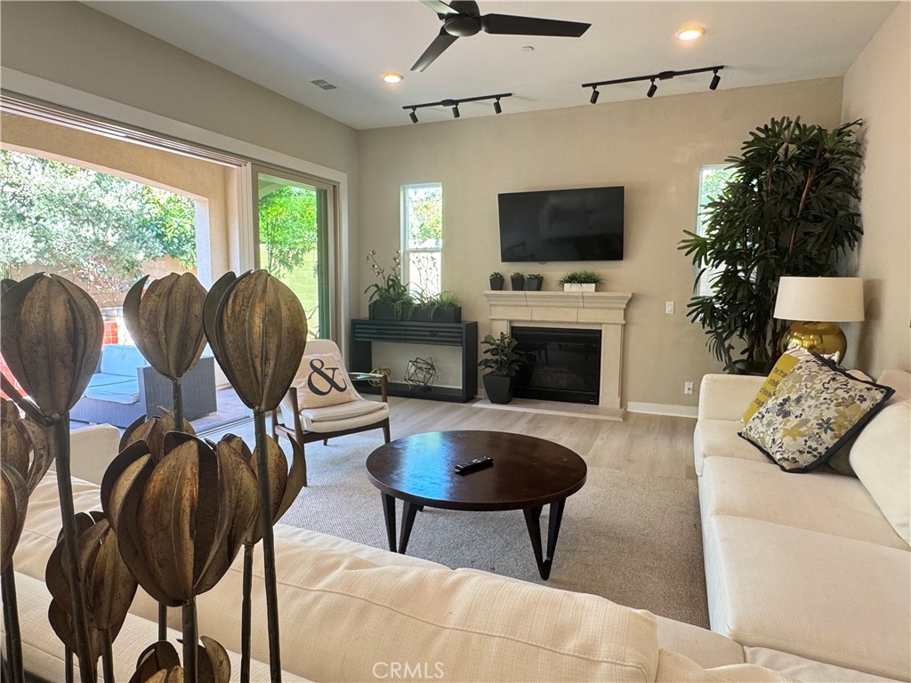 137 Smallwheel Irvine, CA 92618 - Photo 8 of 49 a living room with furniture fireplace and flat screen tv
