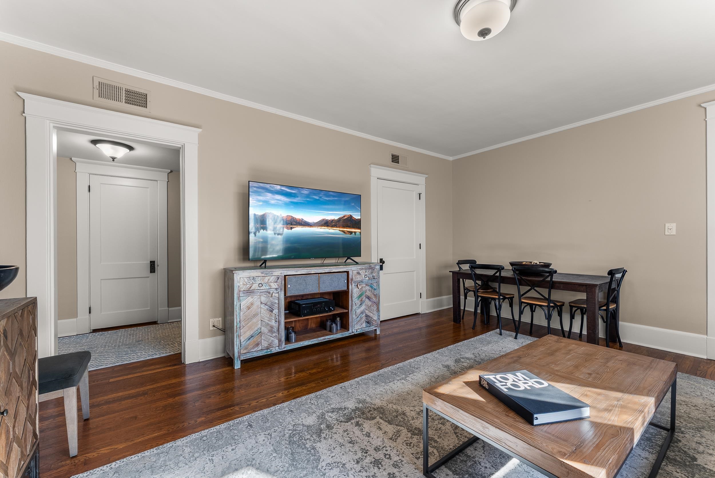 1116 Poplar Avenue, Unit 3 Memphis, TN 38105 - Photo 11 of 25 Living room featuring dark wood finished floors and ornamental molding