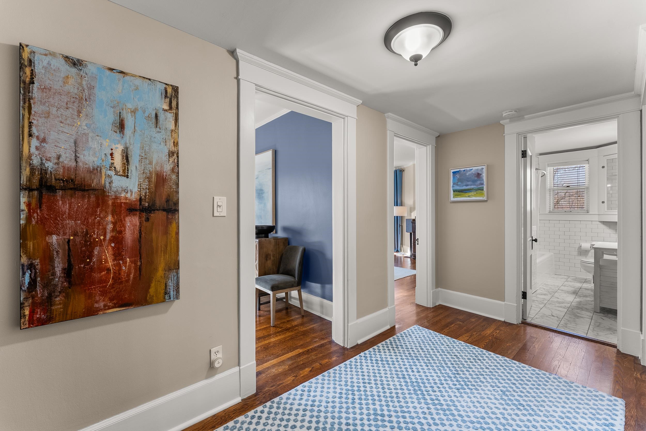 1116 Poplar Avenue, Unit 3 Memphis, TN 38105 - Photo 14 of 25 Bedroom with dark wood-style floors and ensuite bathroom