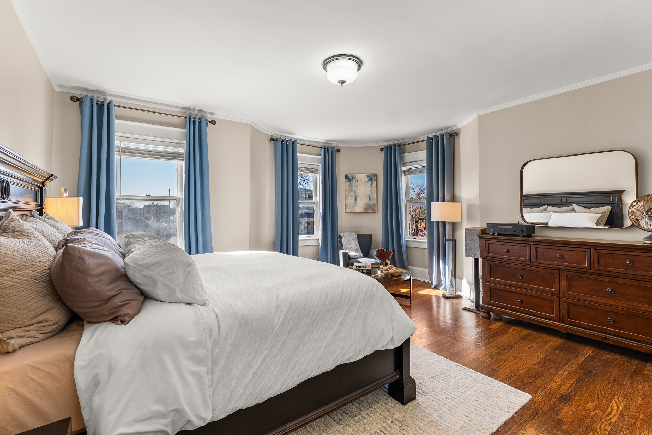 1116 Poplar Avenue, Unit 3 Memphis, TN 38105 - Photo 18 of 25 Bedroom featuring crown molding and dark wood-style flooring